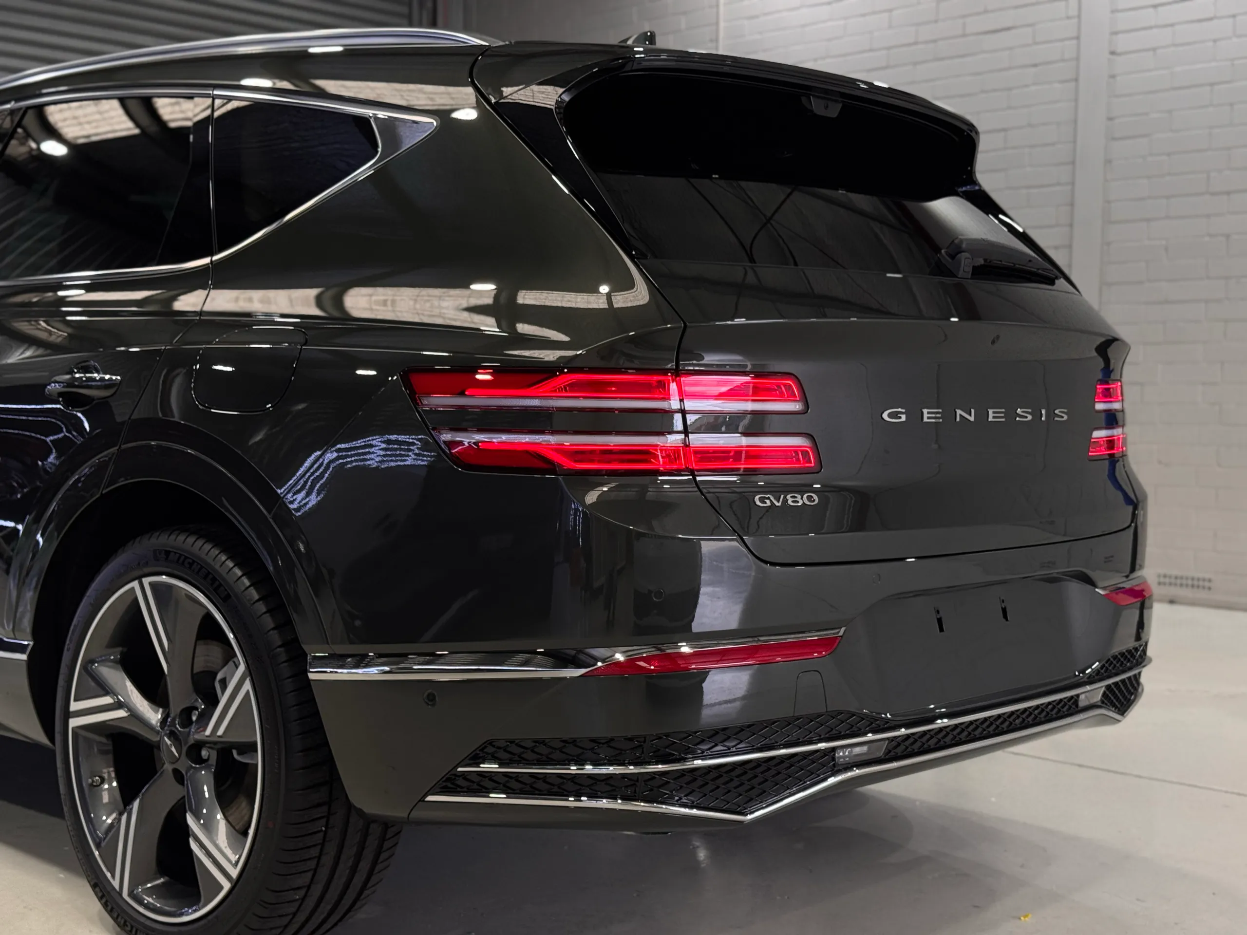 Gloss dark Genesis GV80 rear quarter and tailgate with Genesis and GV80 badges