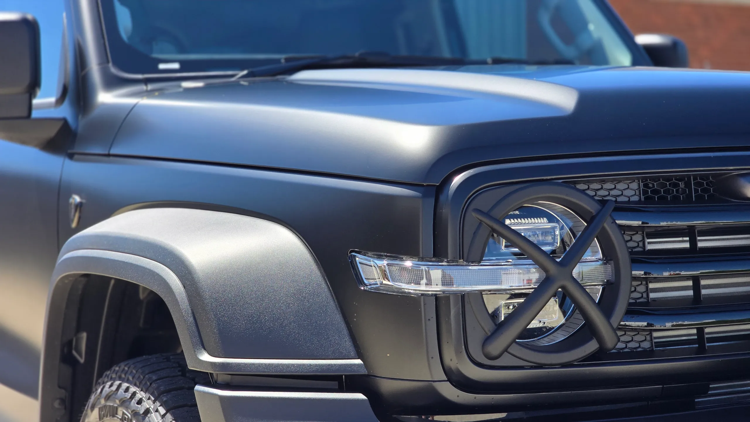 Satin black GWM Tank 300 bonnet, front guard and headlight in sunlight