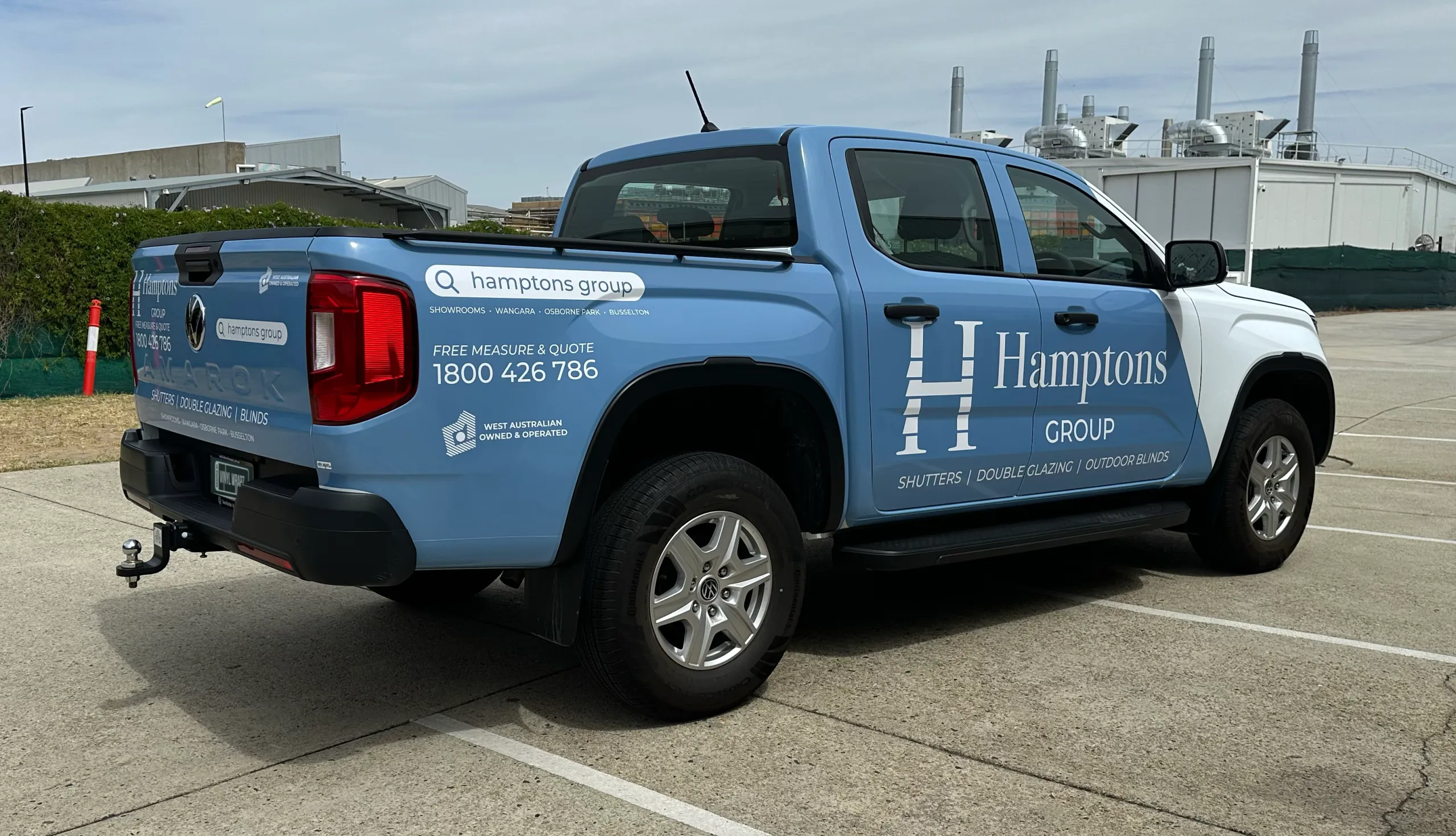 Hamptons Group Volkswagen Amarok viewed from the rear quarter, showing blue tailgate and side graphics