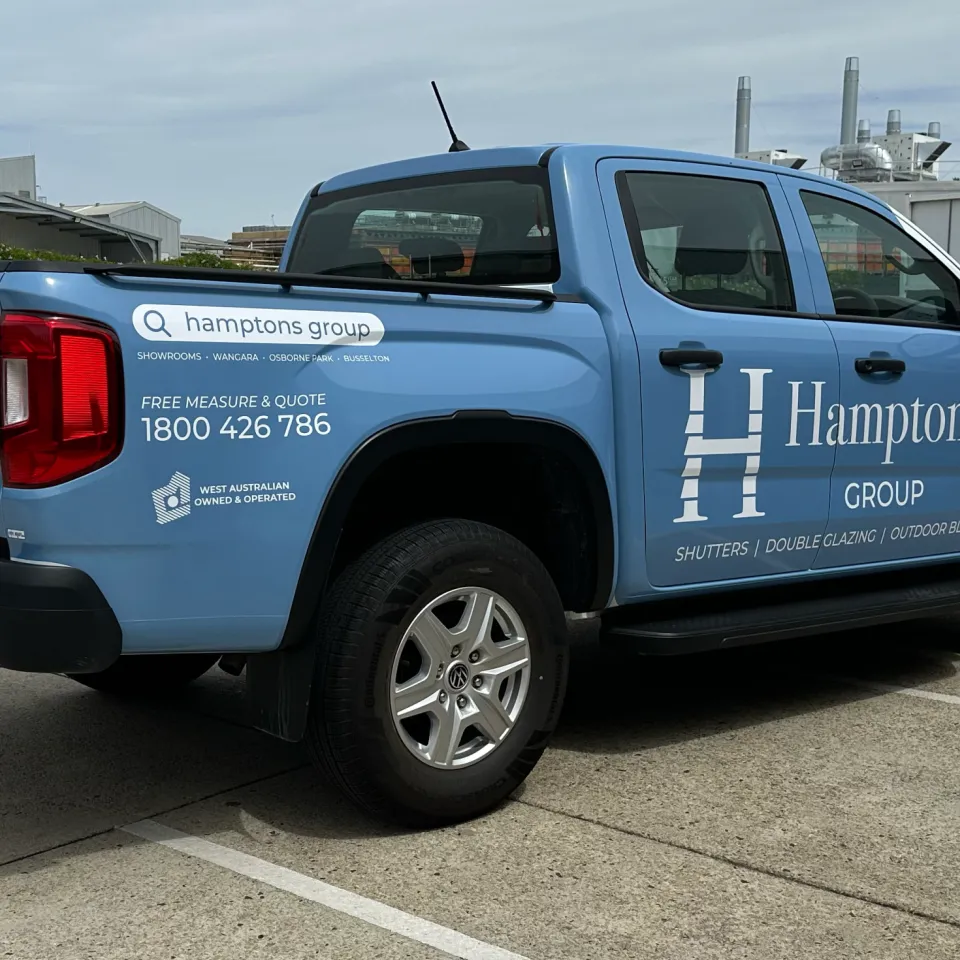 Hamptons Group Volkswagen Amarok viewed from the rear quarter, showing blue tailgate and side graphics