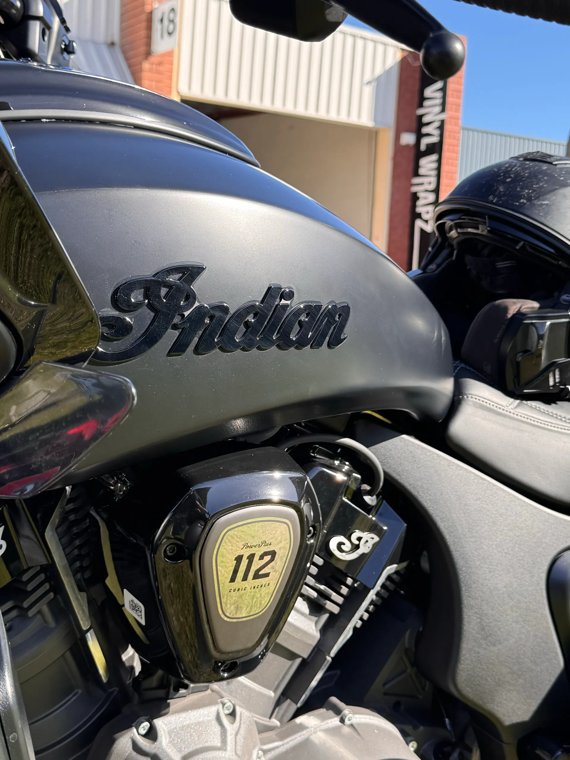 Indian fuel tank badge and 112 engine badge on the matte black motorcycle