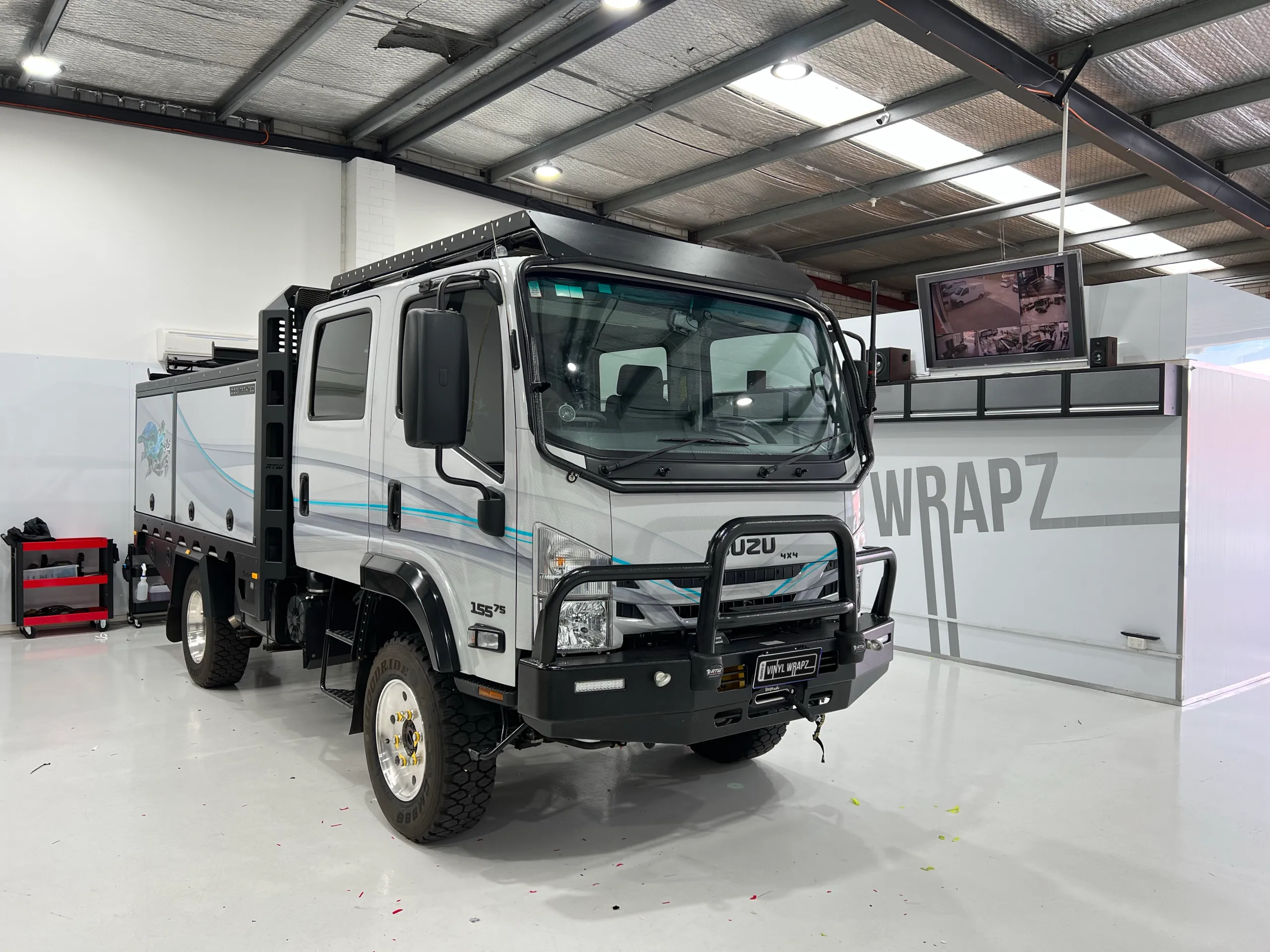 Completed grey Isuzu 4x4 camper viewed from the front quarter