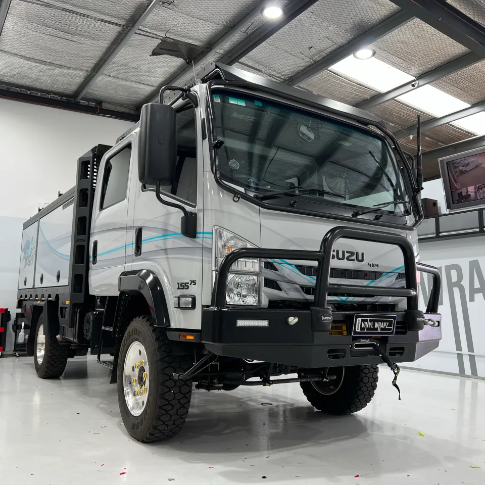 Finished Isuzu camper truck parked outside