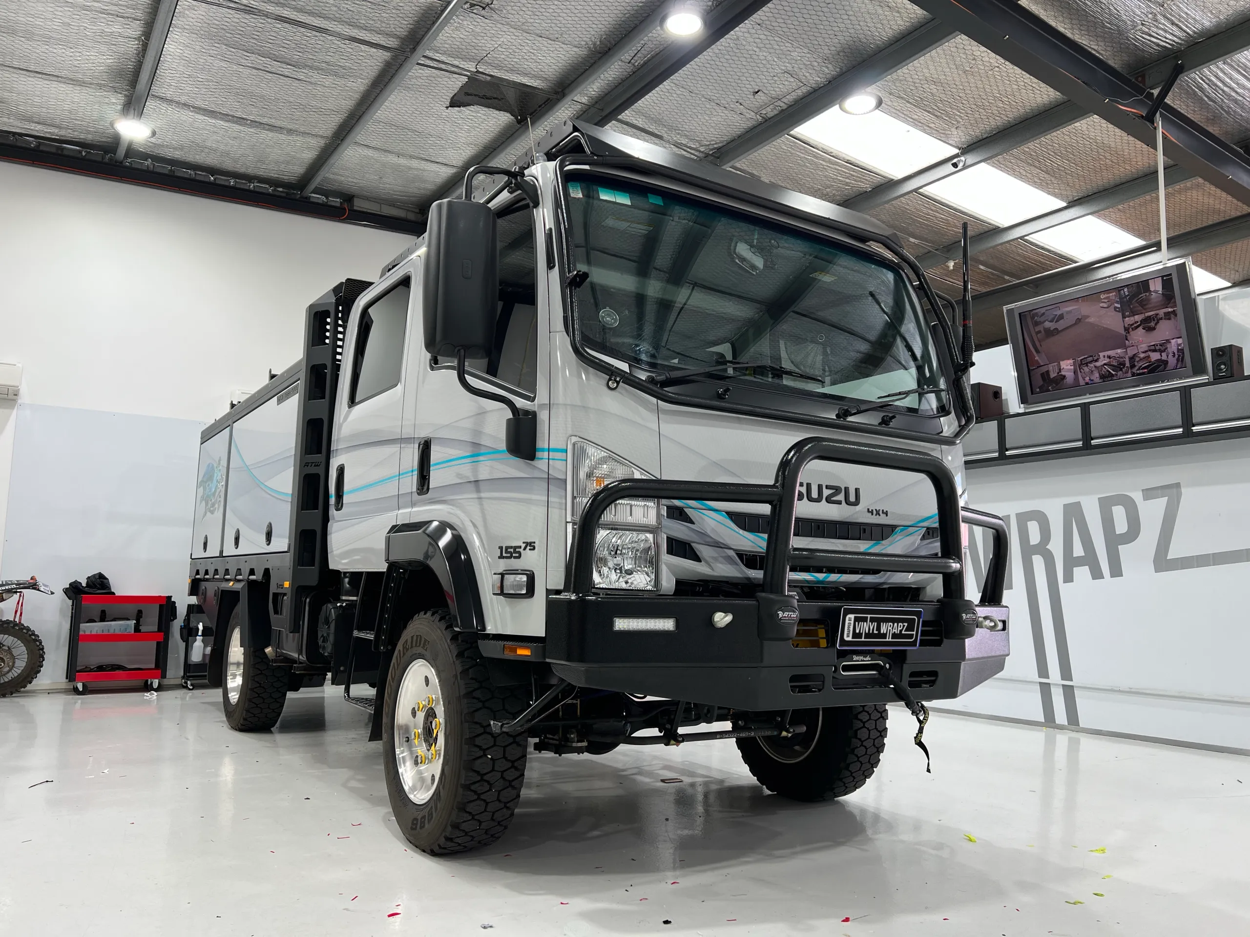Finished Isuzu camper truck parked outside