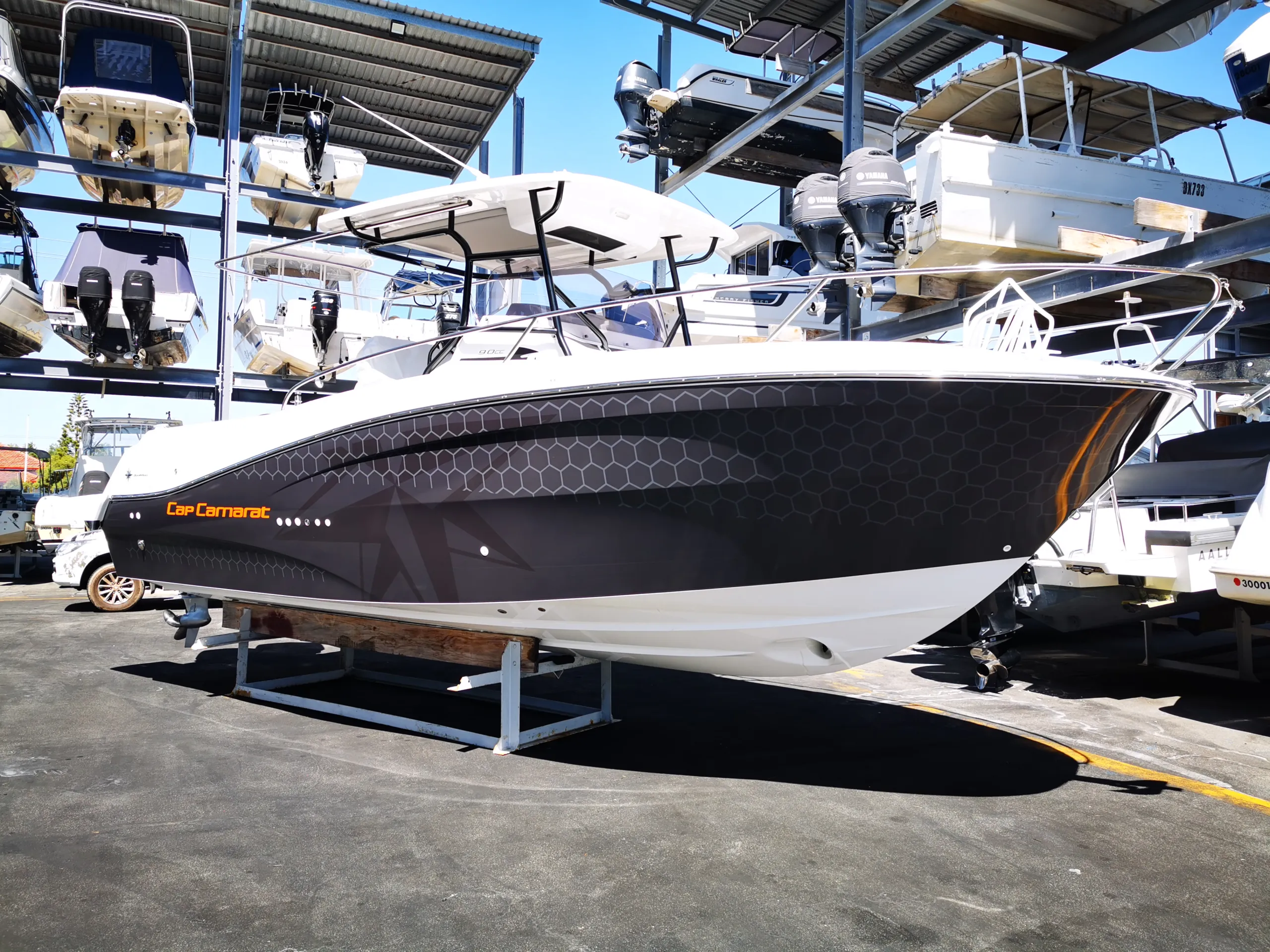 Dark honeycomb hull graphics fitted before the orange stripe and number 9 are added