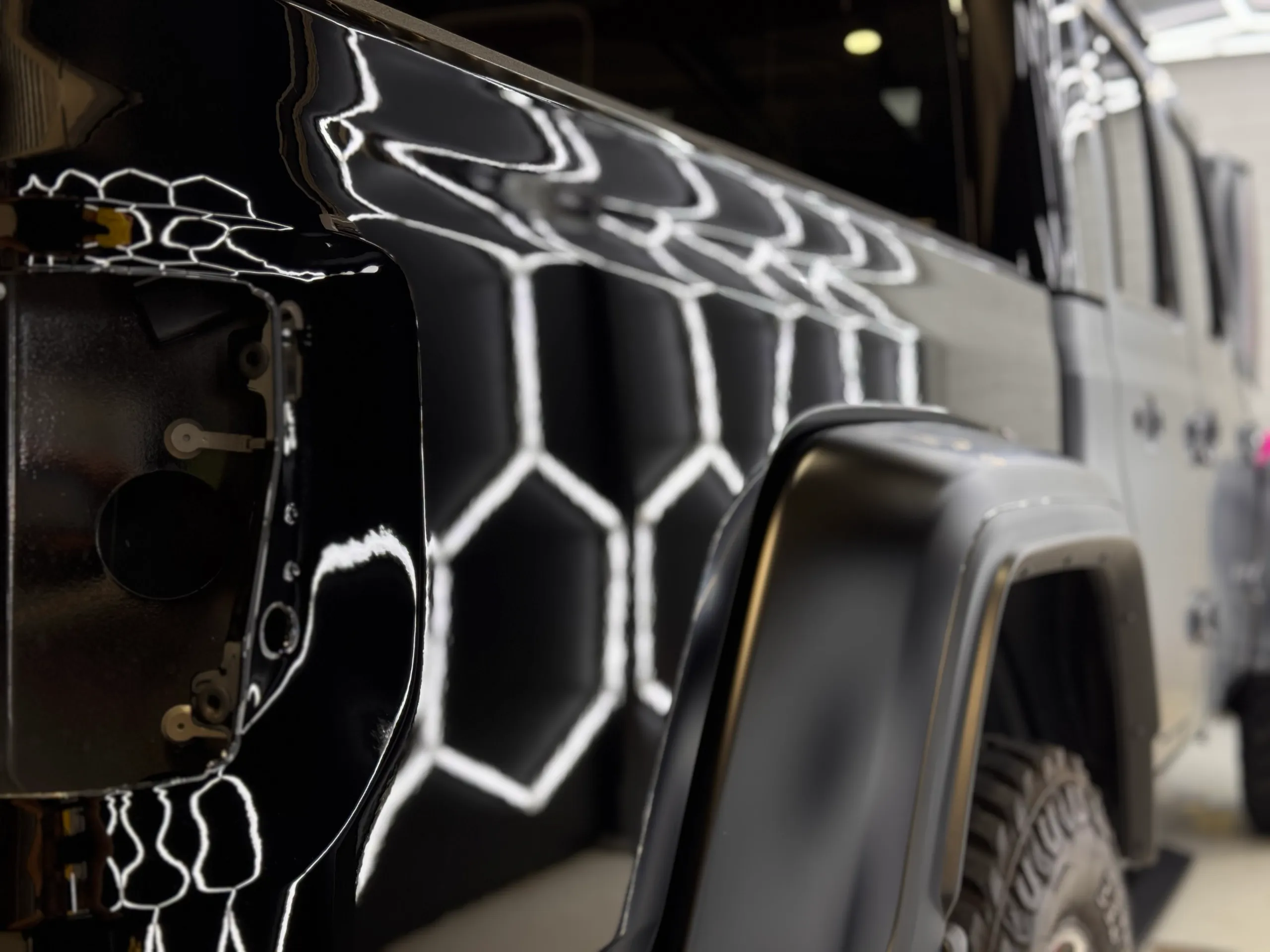 Jeep Gladiator tray side and rear wheel arch with the rear light removed during workshop work