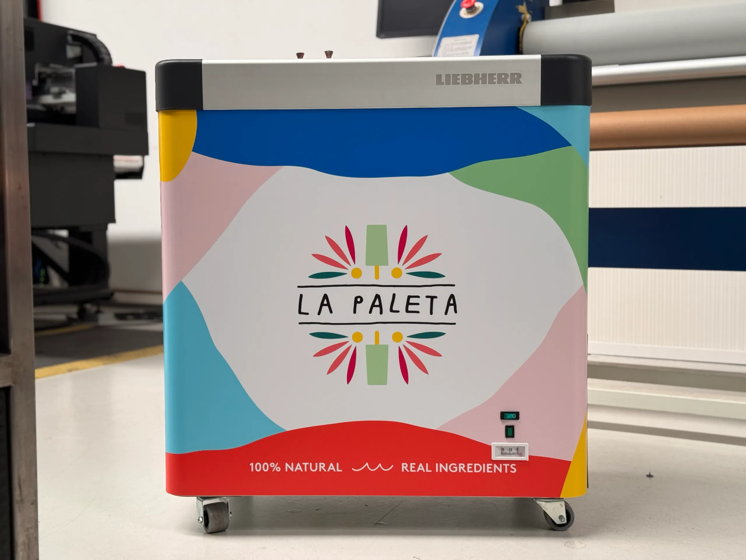 La Paleta logo and colourful printed graphics on the front of a Liebherr freezer