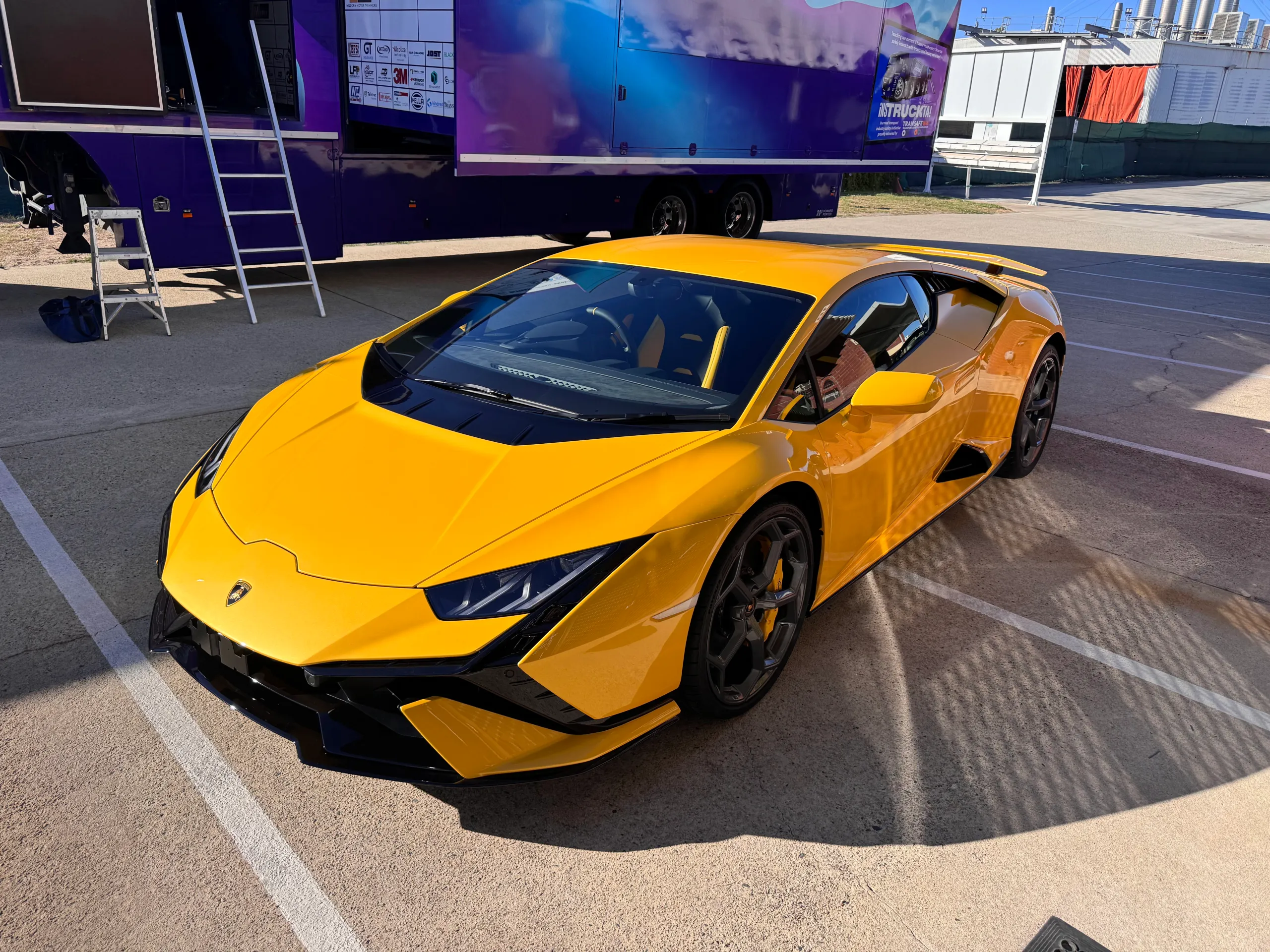 Yellow Lamborghini Huracan Tecnica viewed from above in the car park