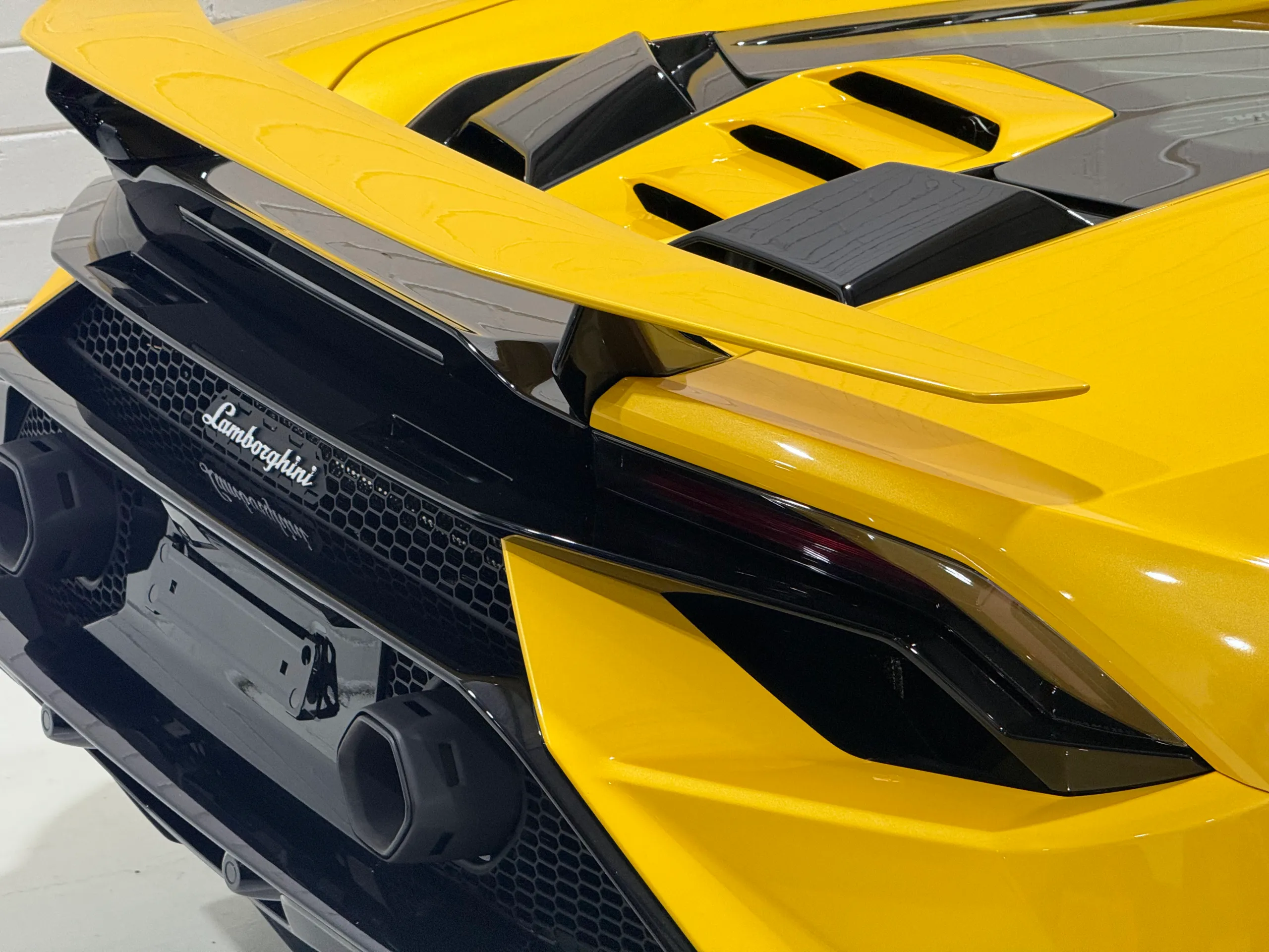 Yellow Lamborghini Huracan Tecnica rear wing, engine cover and rear badging