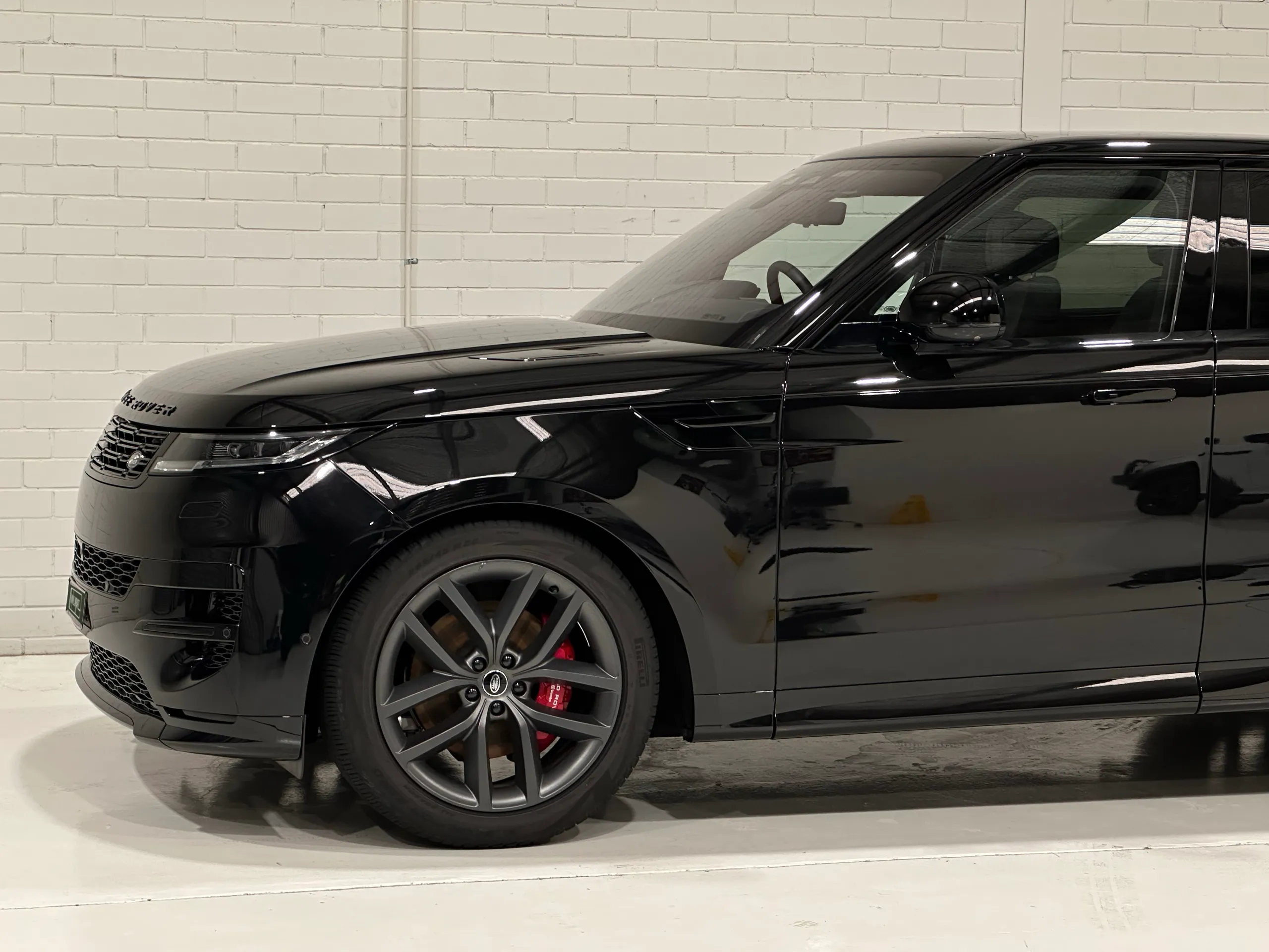 Range Rover Sport front wheel, bonnet and front door in gloss black