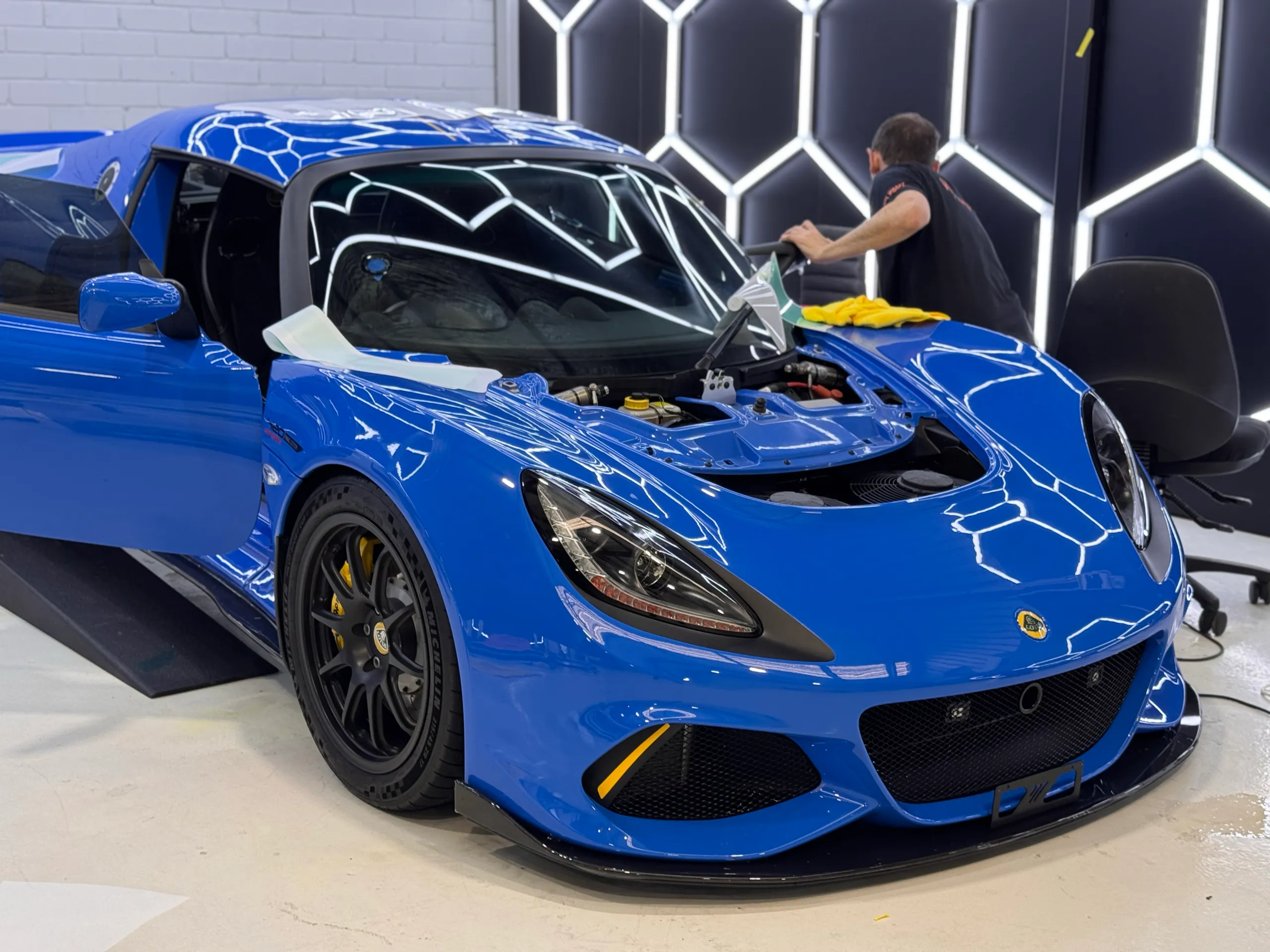 Blue Lotus Exige with the front access panel removed during film installation