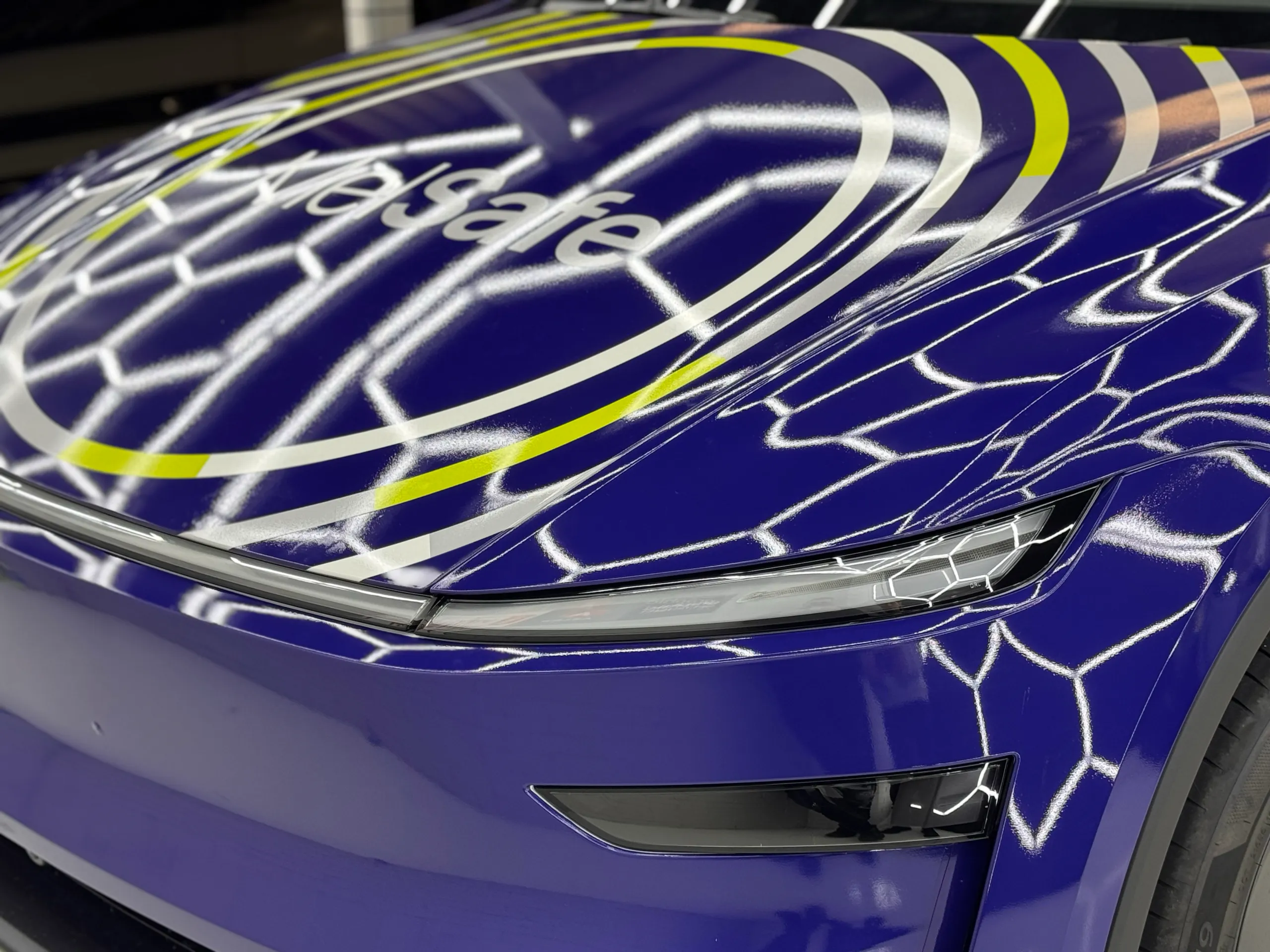 Close view of the MelSafe bonnet graphics and Tesla front light bar