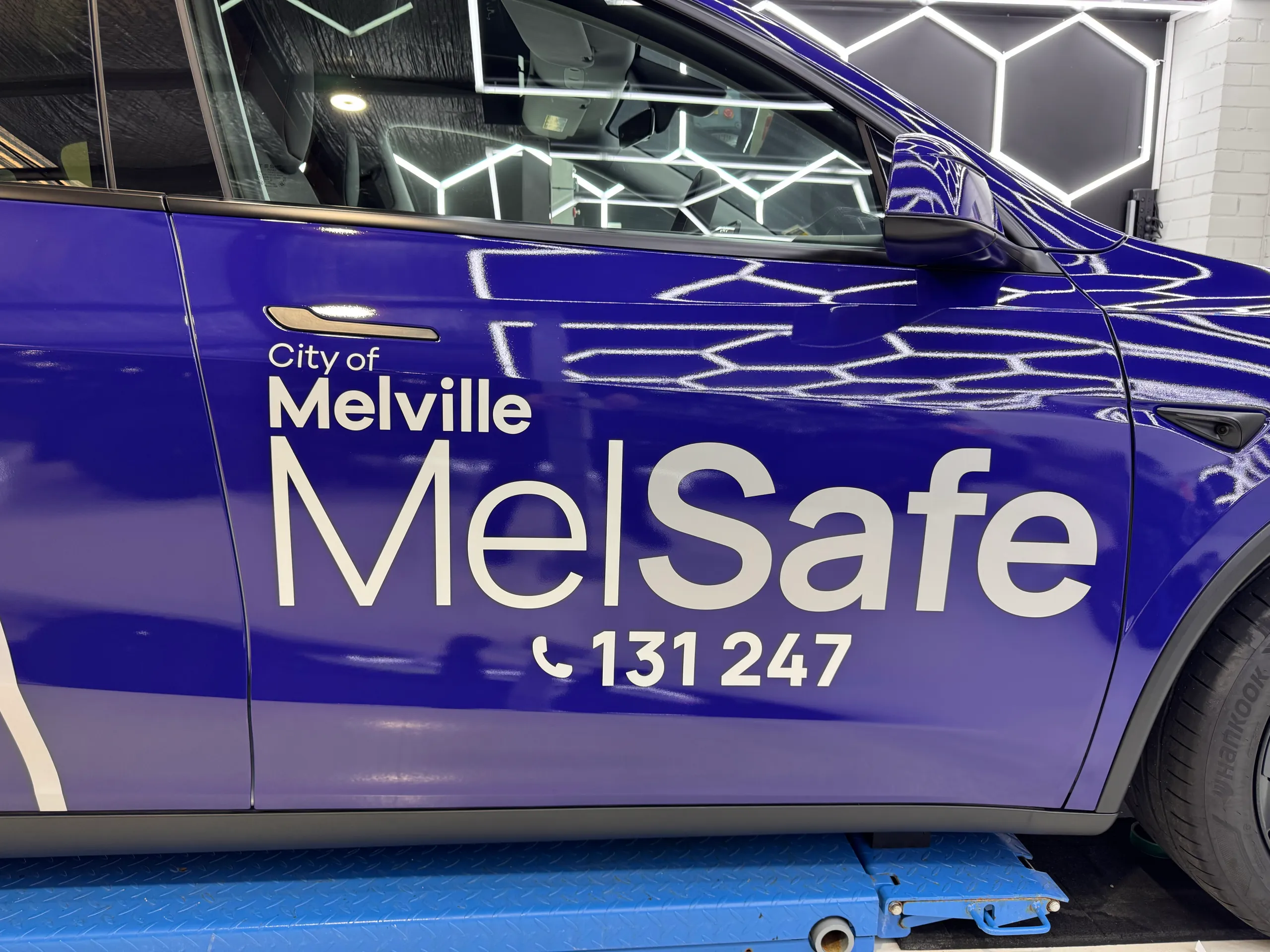 City of Melville MelSafe lettering on the blue Tesla front door