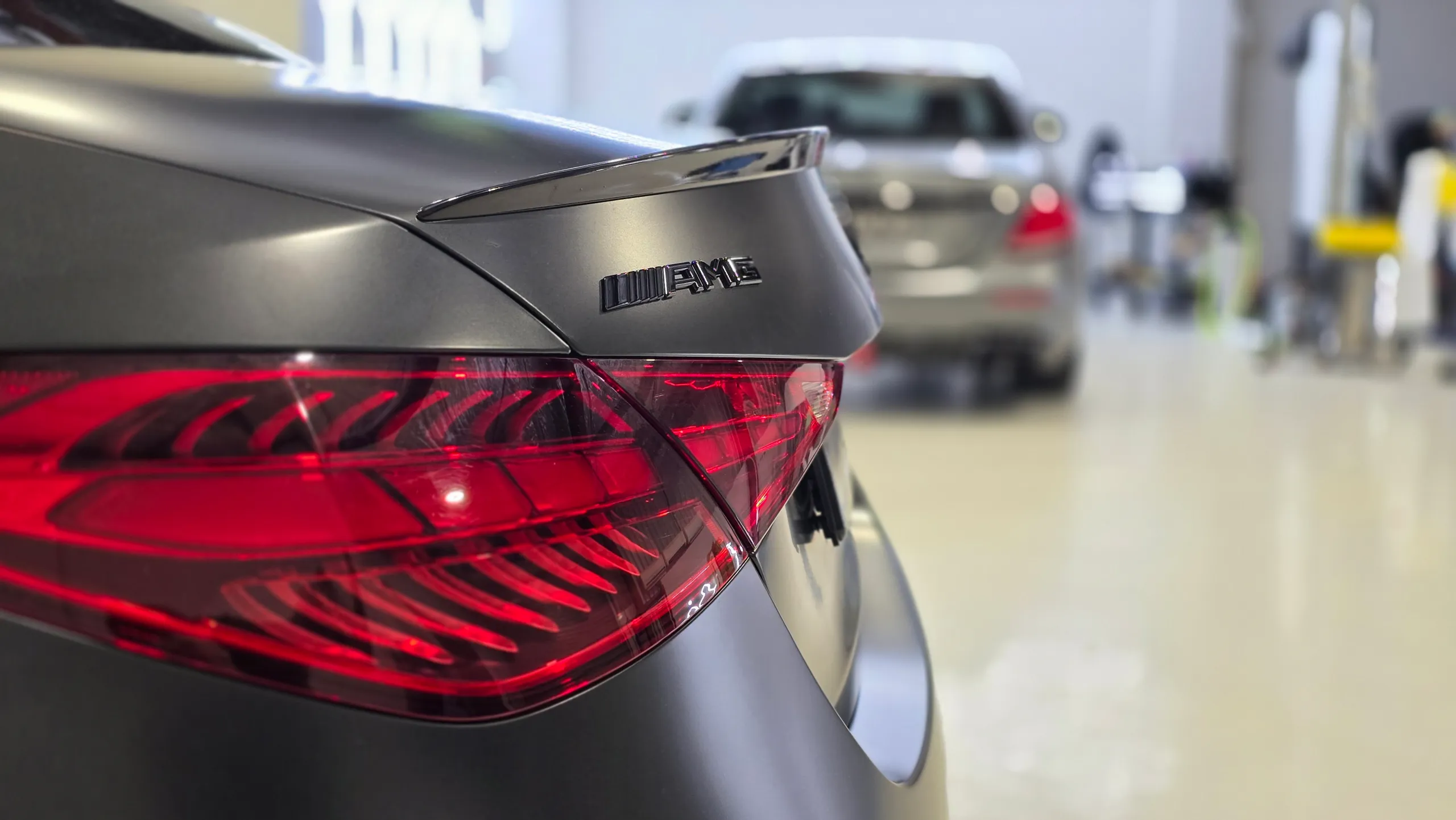 AMG boot badge, black spoiler and rear light on the satin dark grey Mercedes
