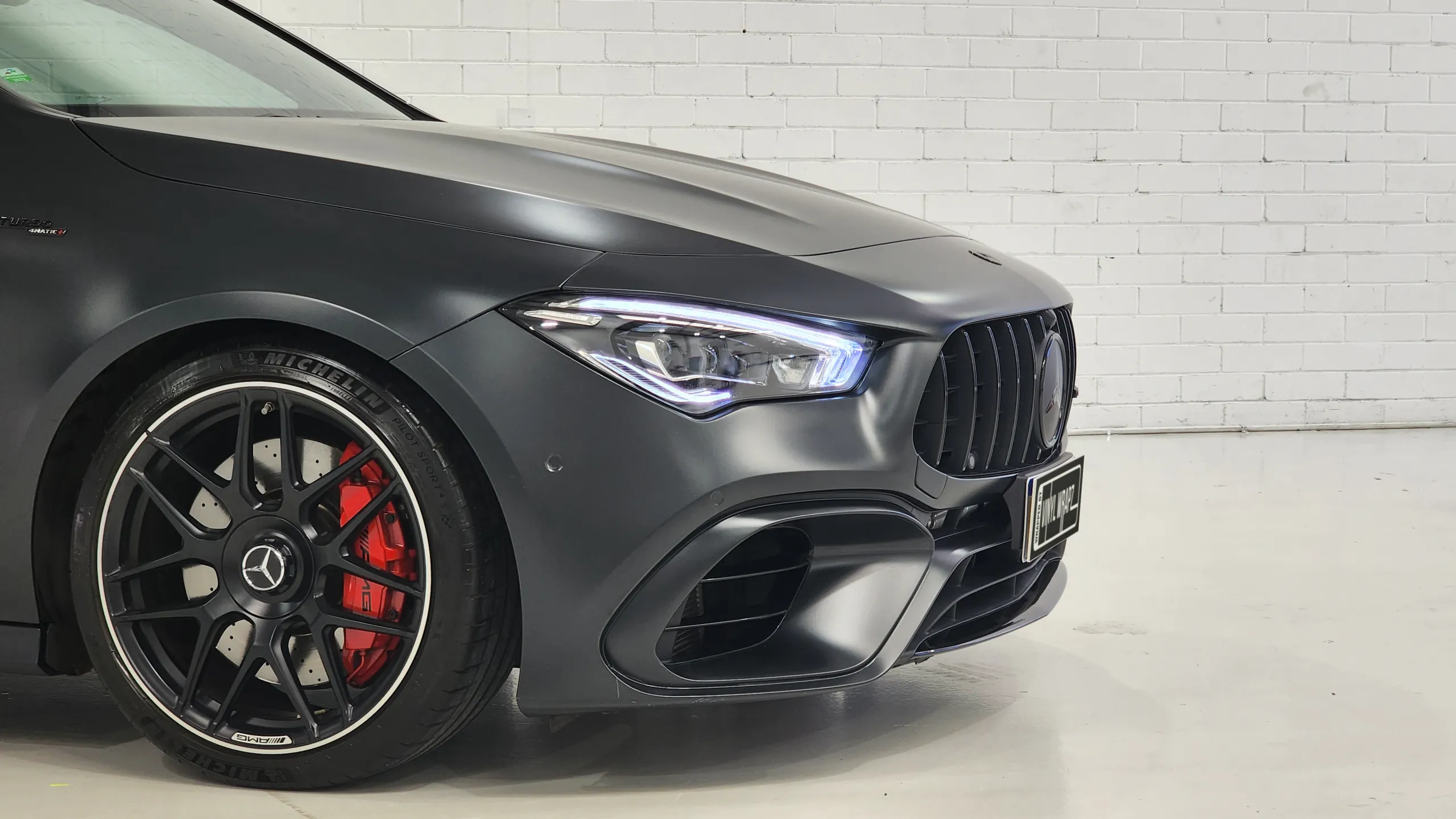 Mercedes-AMG CLA 45 S front wheel, red brake caliper and satin dark grey guard