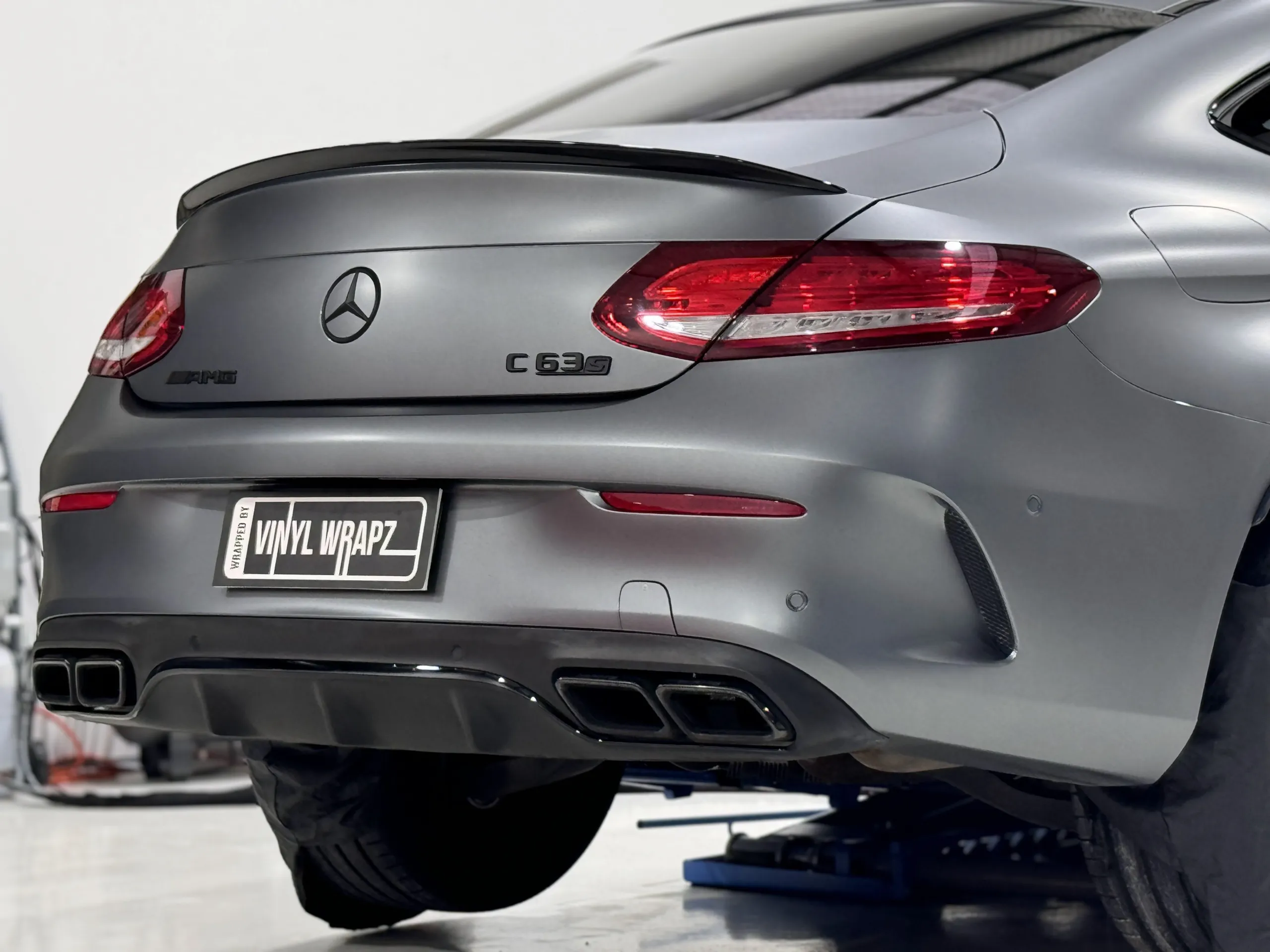 Satin grey Mercedes-AMG C63 S boot, rear lights and diffuser in the workshop