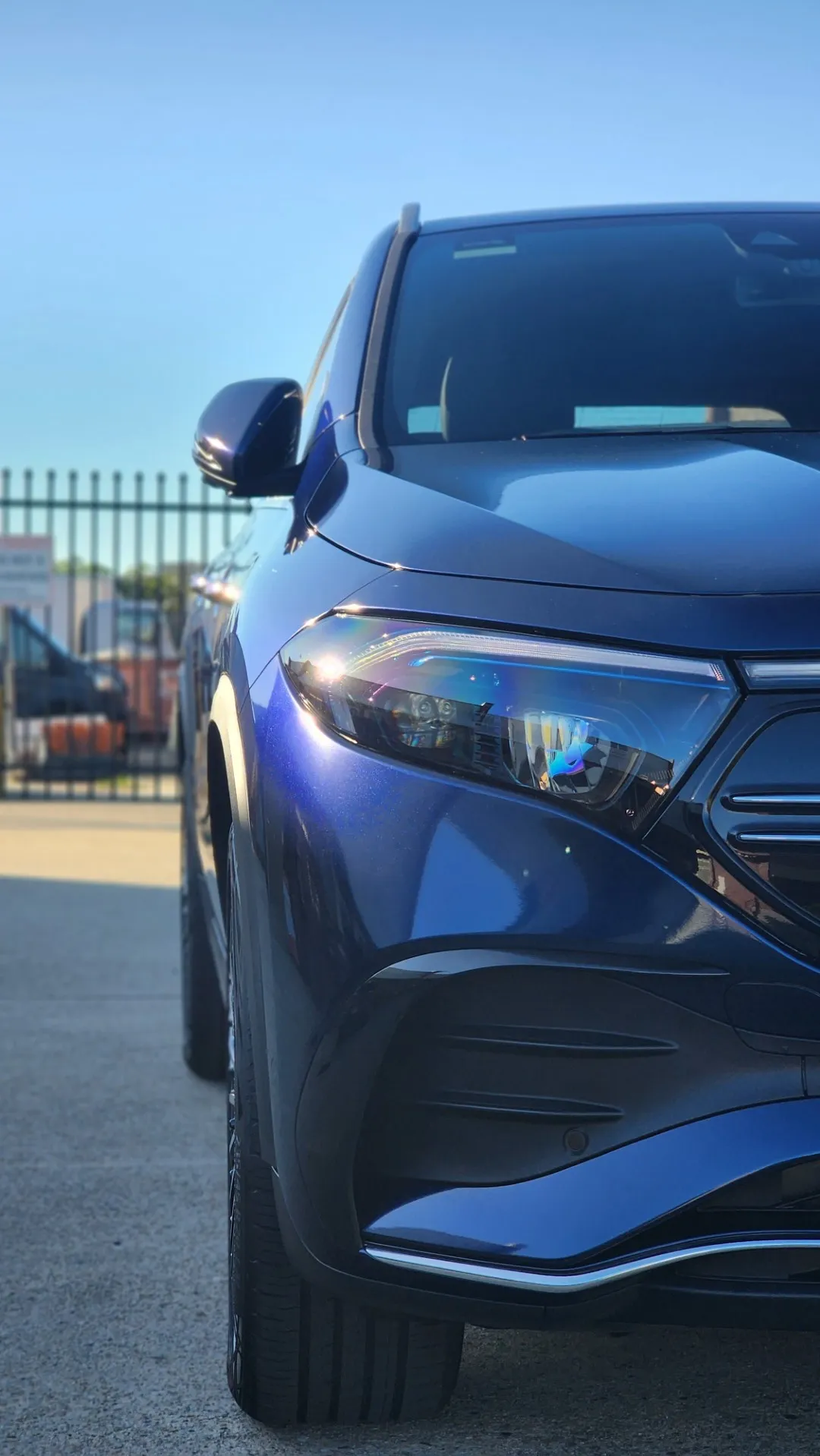 Blue and black iridescent Mercedes-Benz EQA, front detail