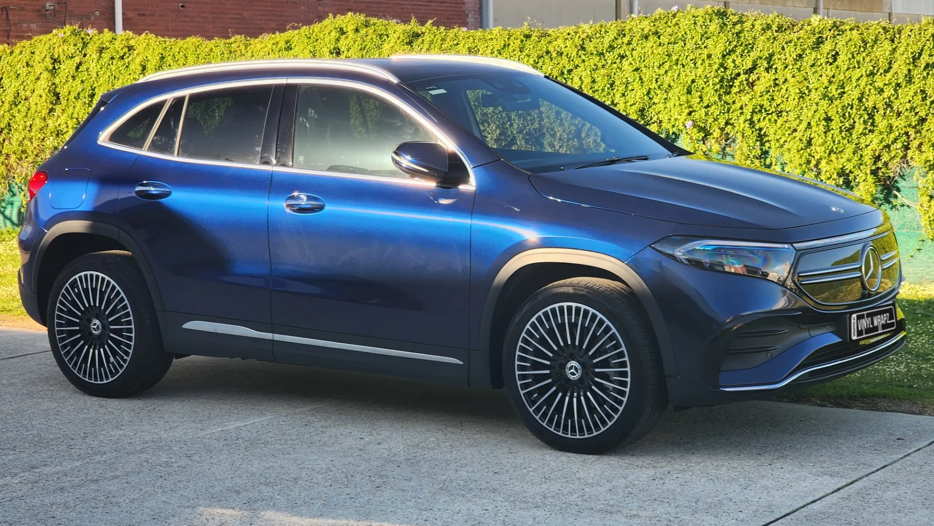 Blue and black iridescent Mercedes-Benz EQA, front quarter