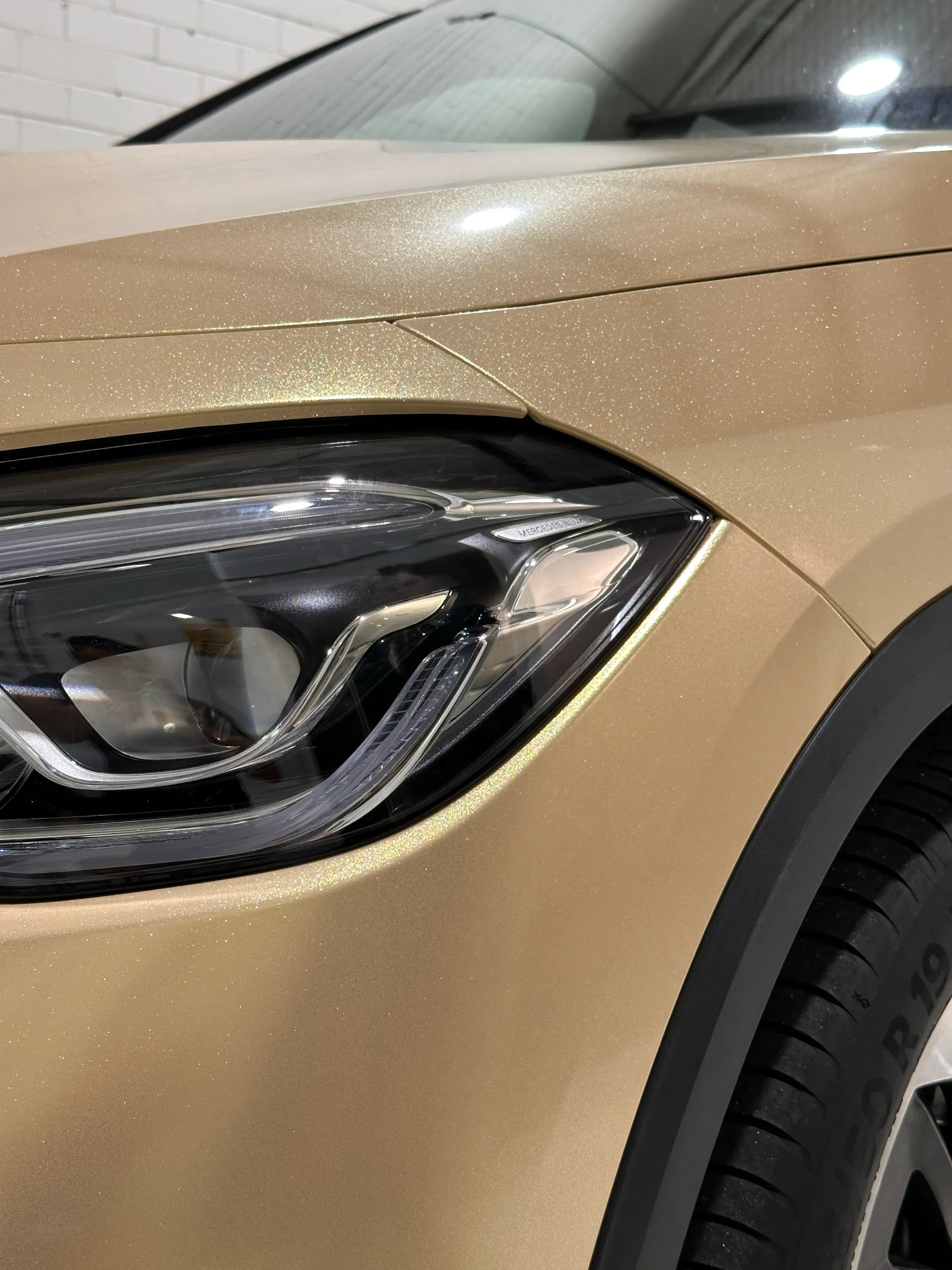 Gold shimmer finish around the Mercedes-Benz GLA headlight and front guard