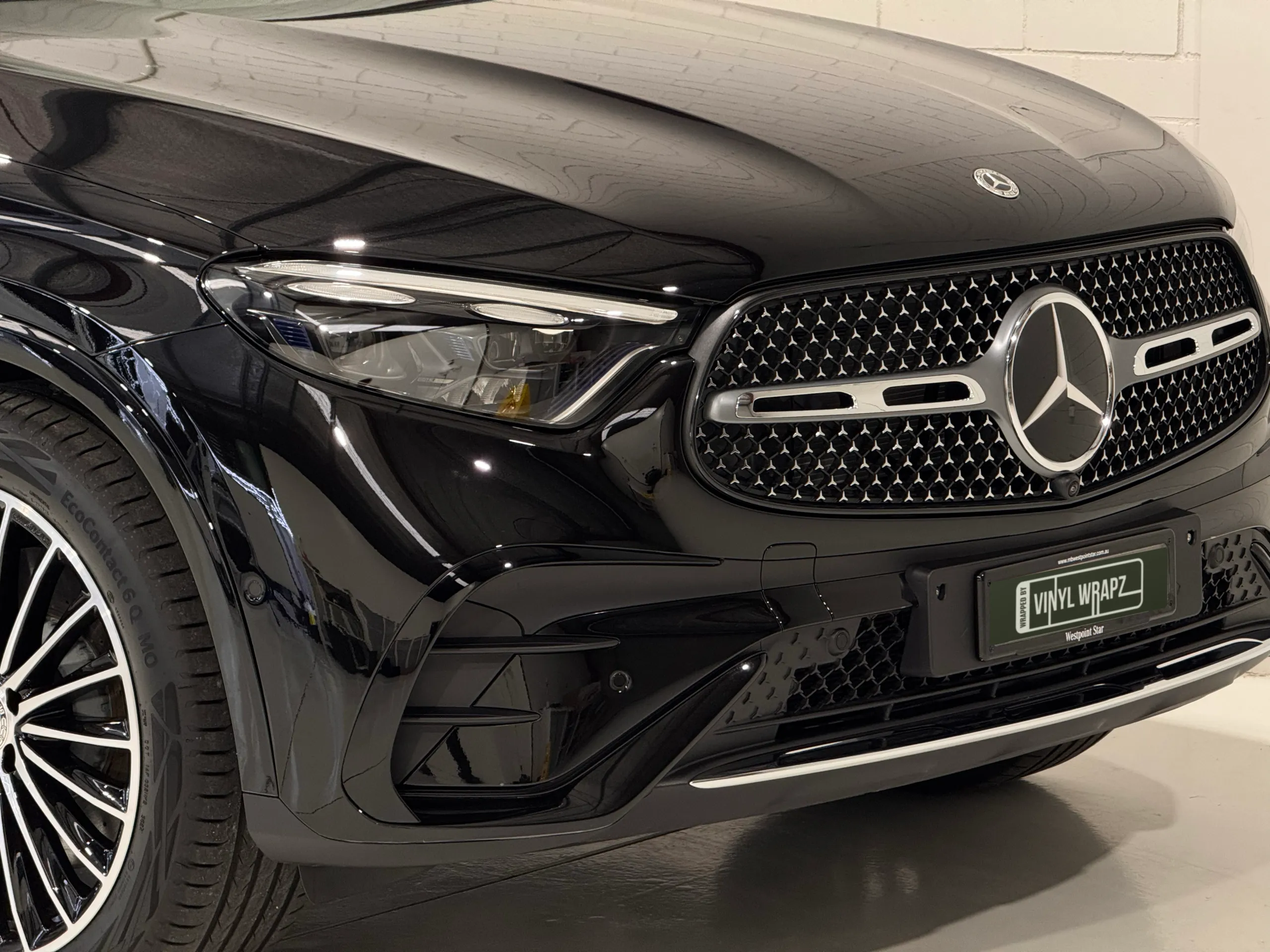Gloss black Mercedes-Benz GLC 300 grille, headlight and front bumper in the workshop