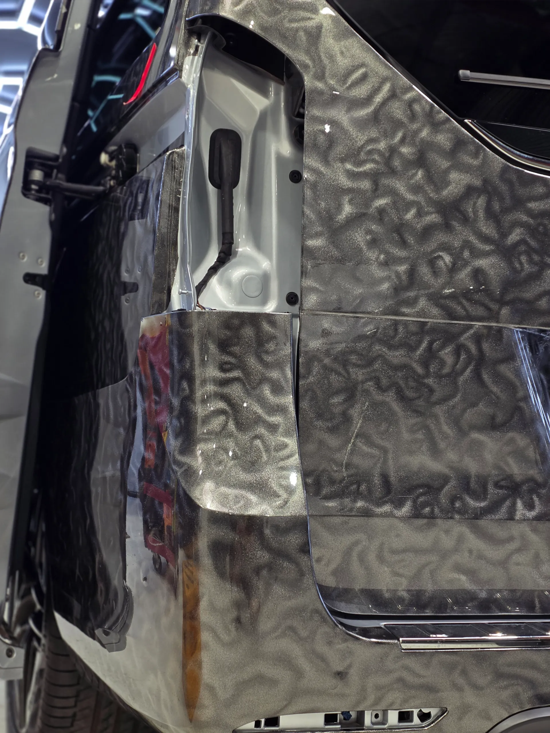 Patterned grey film around the Mercedes-Benz V-Class rear-light opening with the light removed