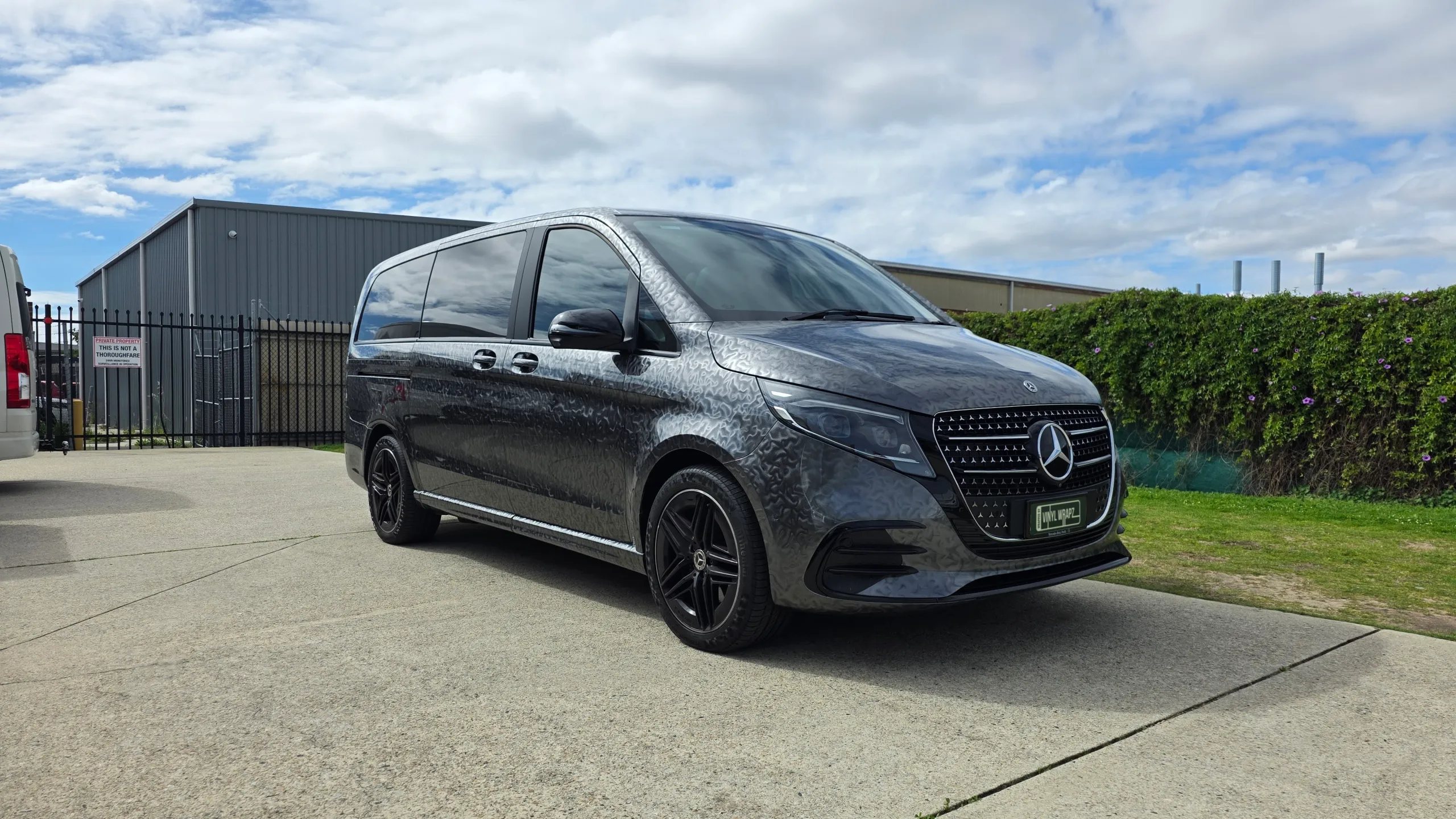 Mercedes-Benz V-Class with a patterned grey finish parked outside the workshop