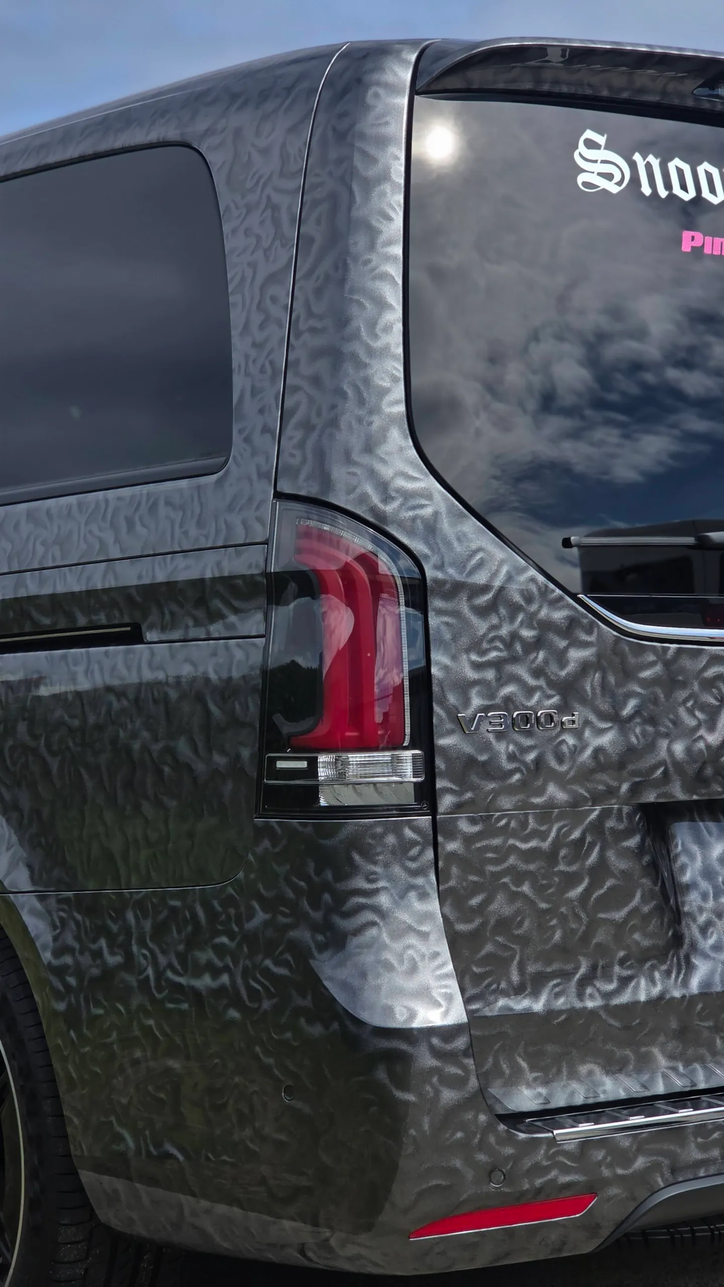 V300 d badge and rear light on the patterned grey Mercedes-Benz V-Class