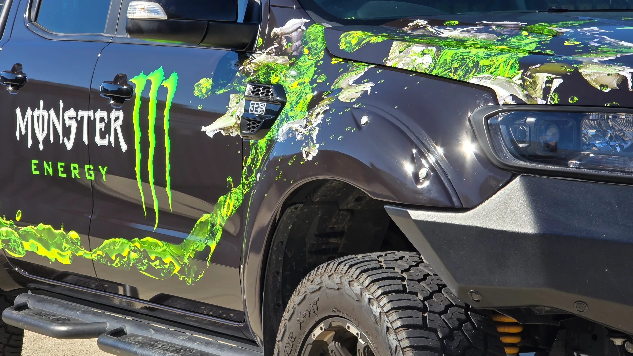 Green splash artwork around the Ford Ranger front guard beside the Monster Energy logo