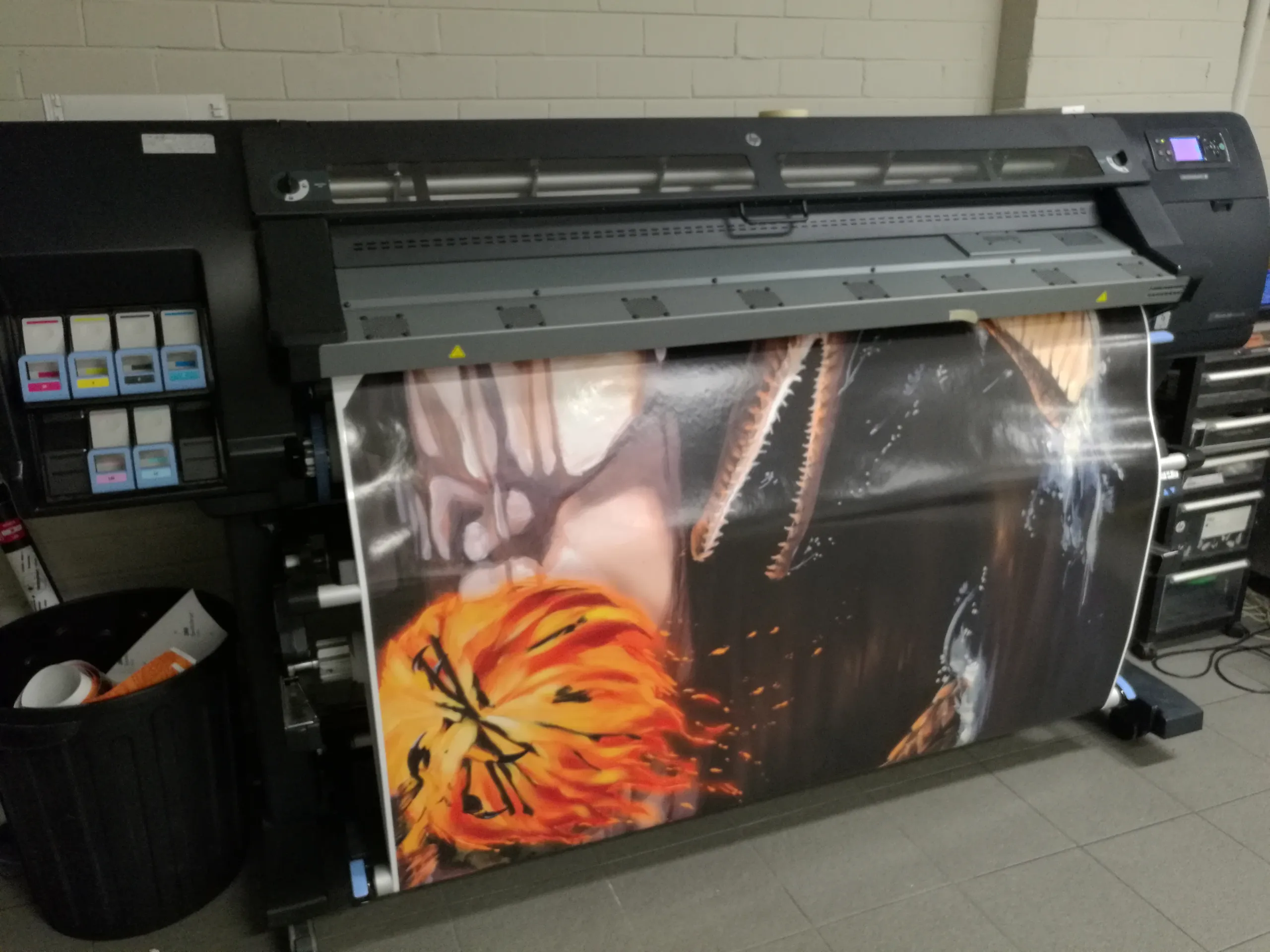 Large-format printer producing a colourful wildlife graphic for the boat wrap