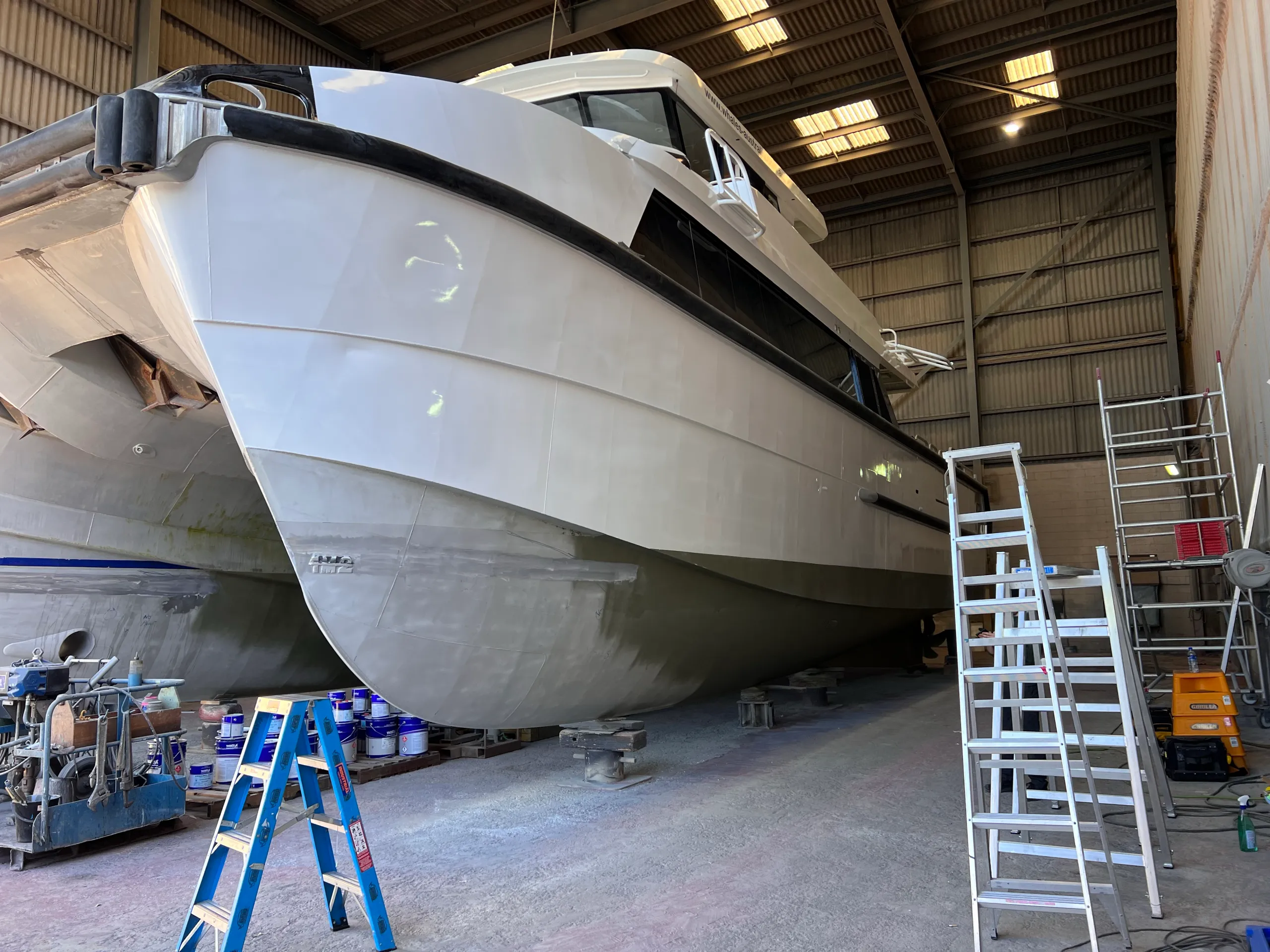 Naturaliste Charters catamaran bow before the blue hull graphics were fitted