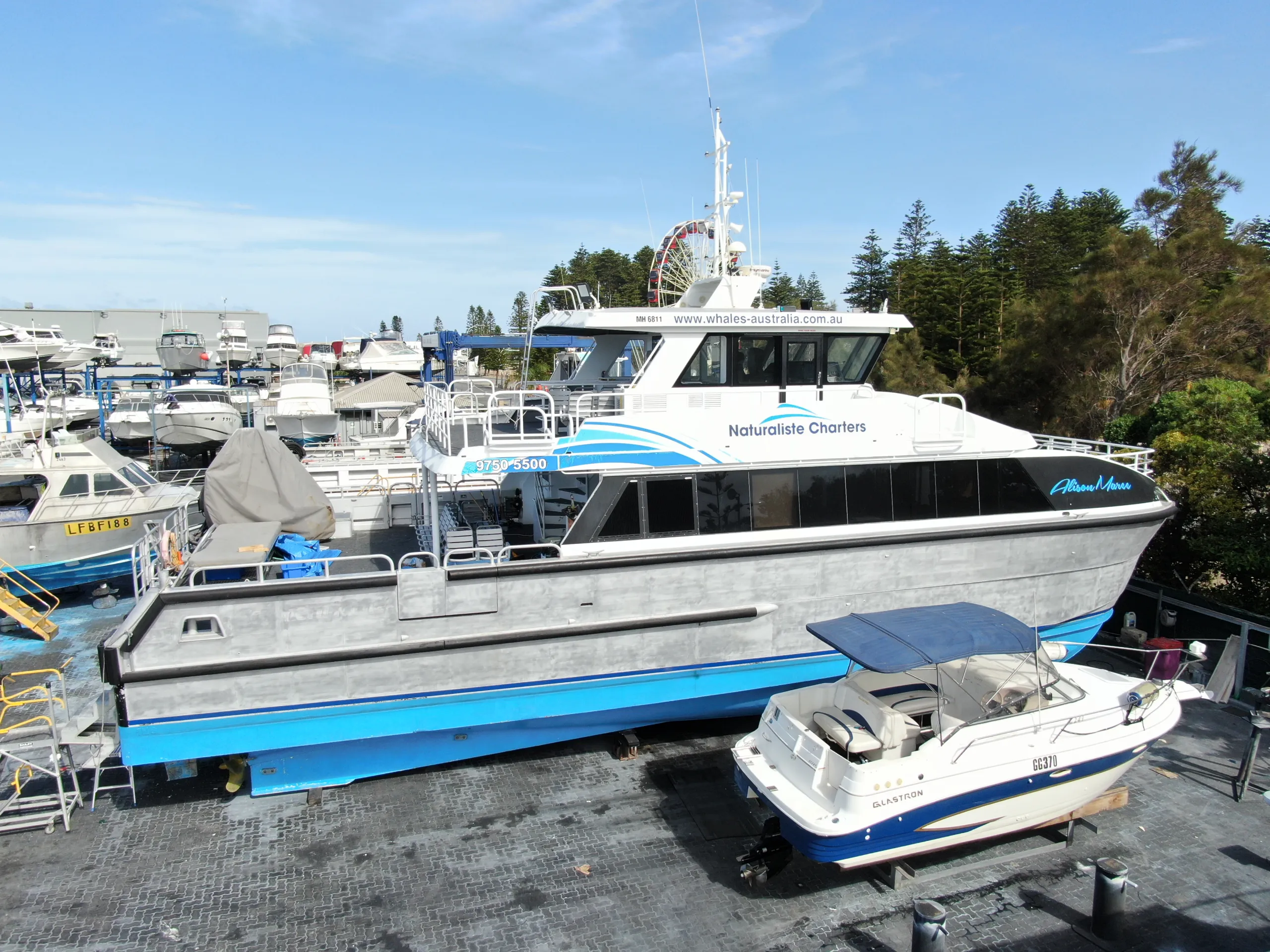 Elevated boatyard view of Alison-Maree before the blue hull graphics were fitted