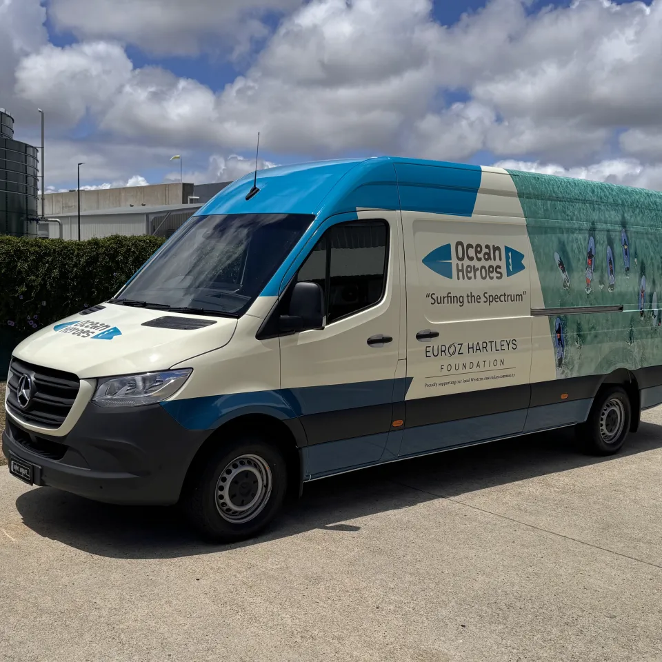 Portrait front-quarter view of the Ocean Heroes van outdoors