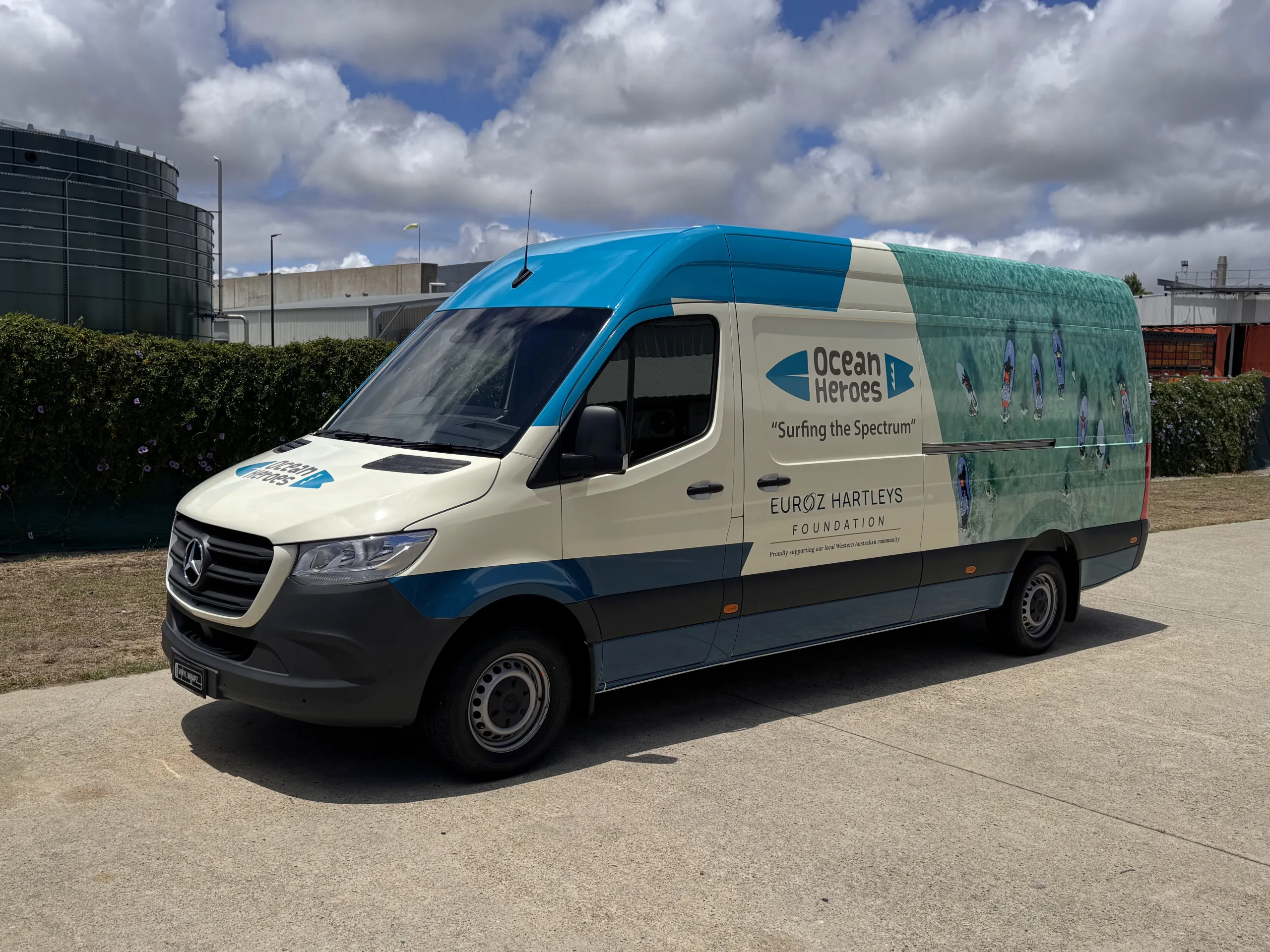 Portrait front-quarter view of the Ocean Heroes van outdoors