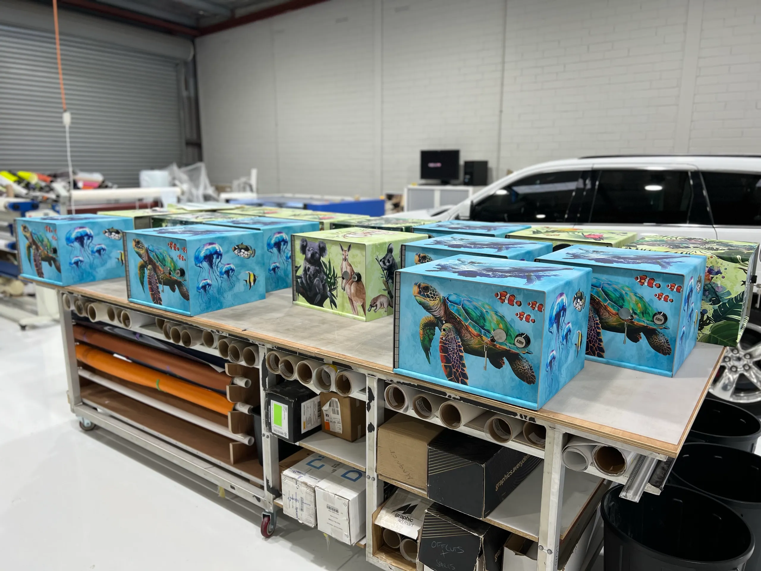Row of medical lockers with ocean and turtle graphics on the bench