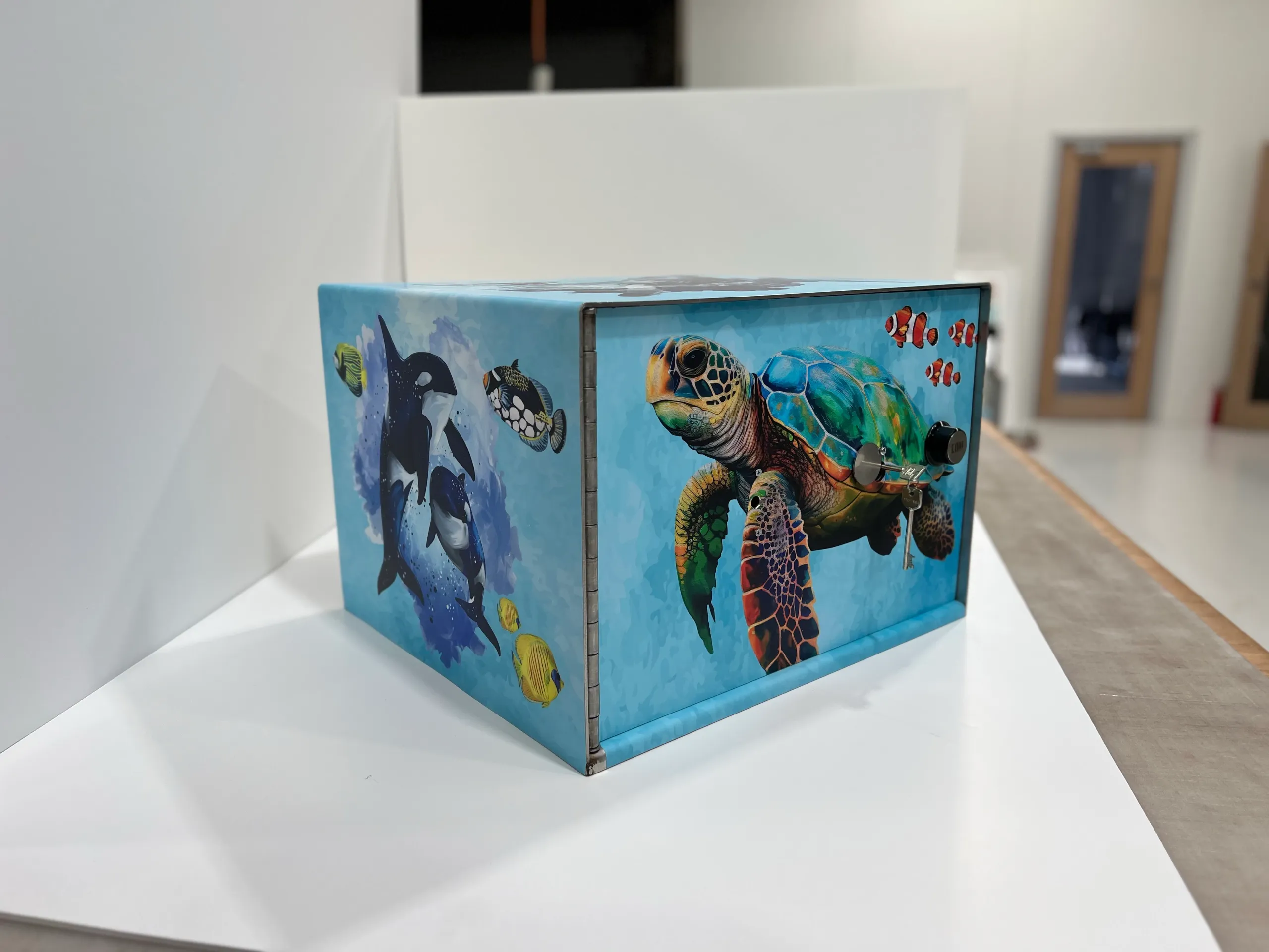 Single medical locker with turtle and ocean artwork indoors
