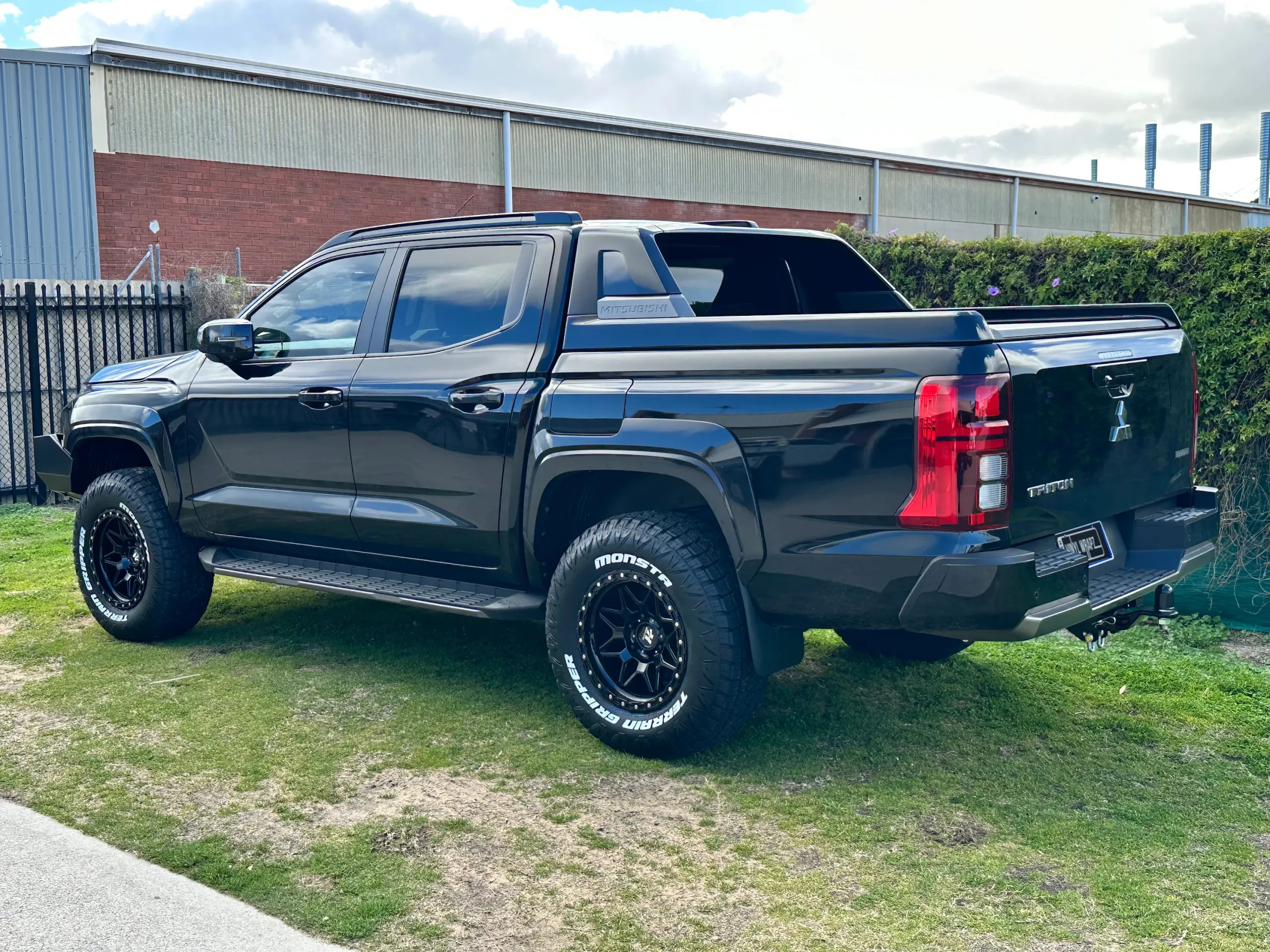 Black Mitsubishi Triton before the Perth Scuba graphics were applied