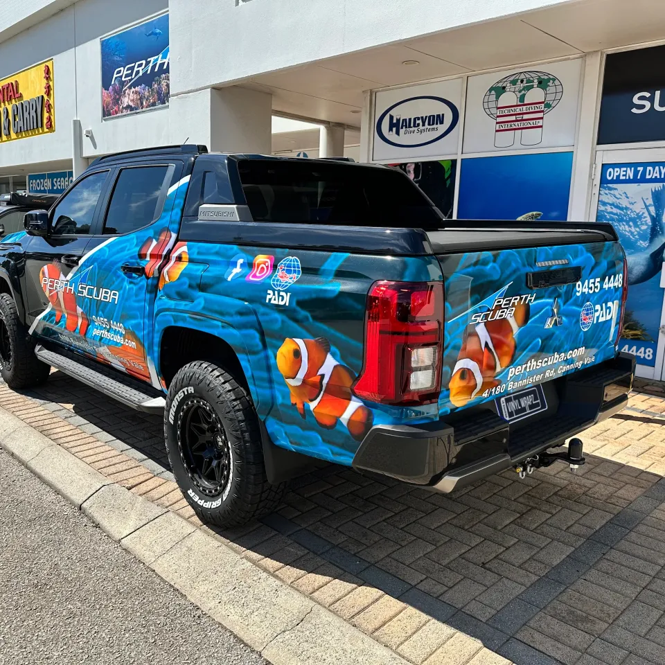 Perth Scuba Triton rear quarter with clownfish graphics outside the dive shop