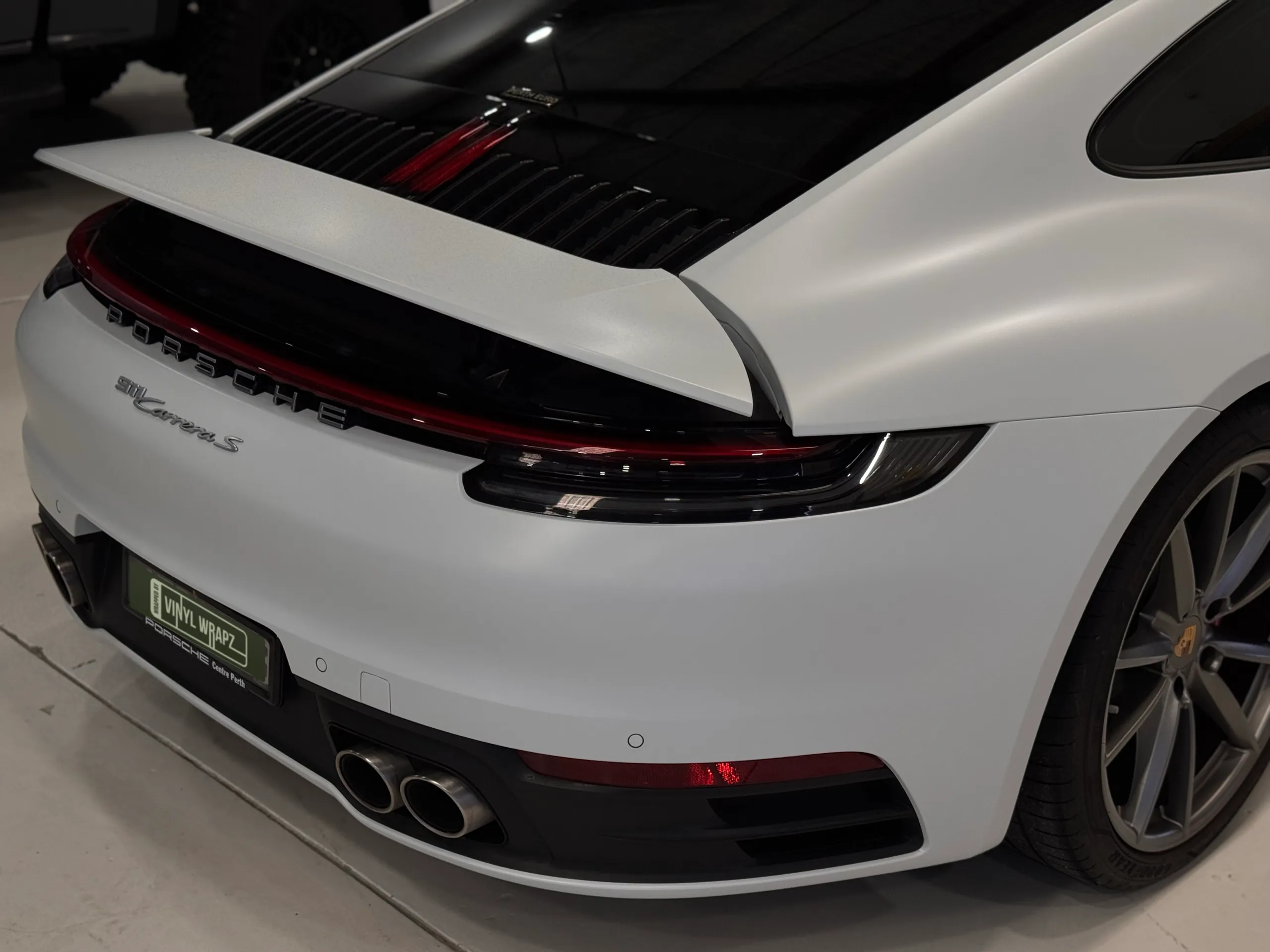 Porsche 911 Carrera S rear badge, raised spoiler and white rear bodywork