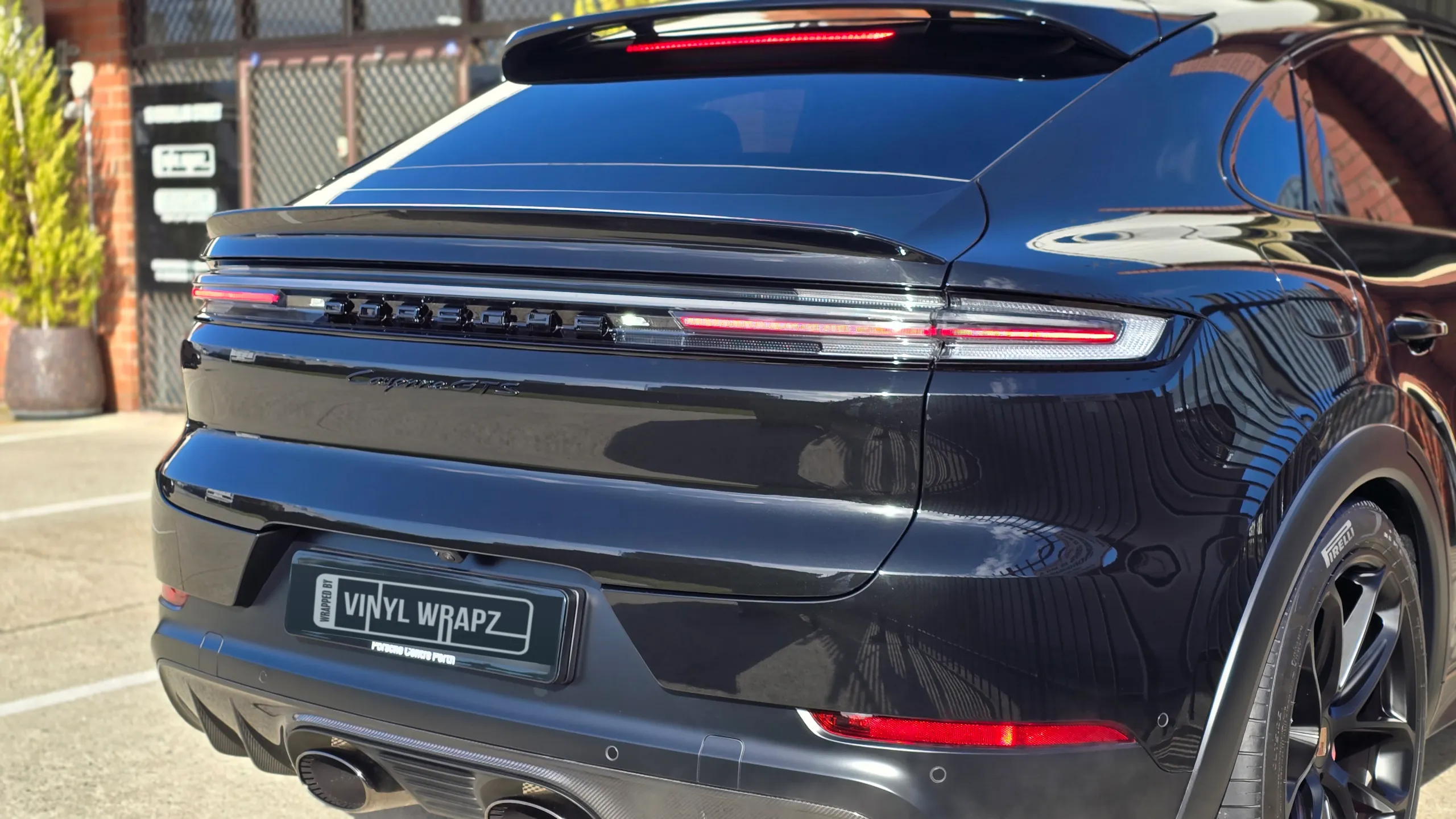 Gloss black Porsche Cayenne GTS tailgate and rear lights outside the workshop