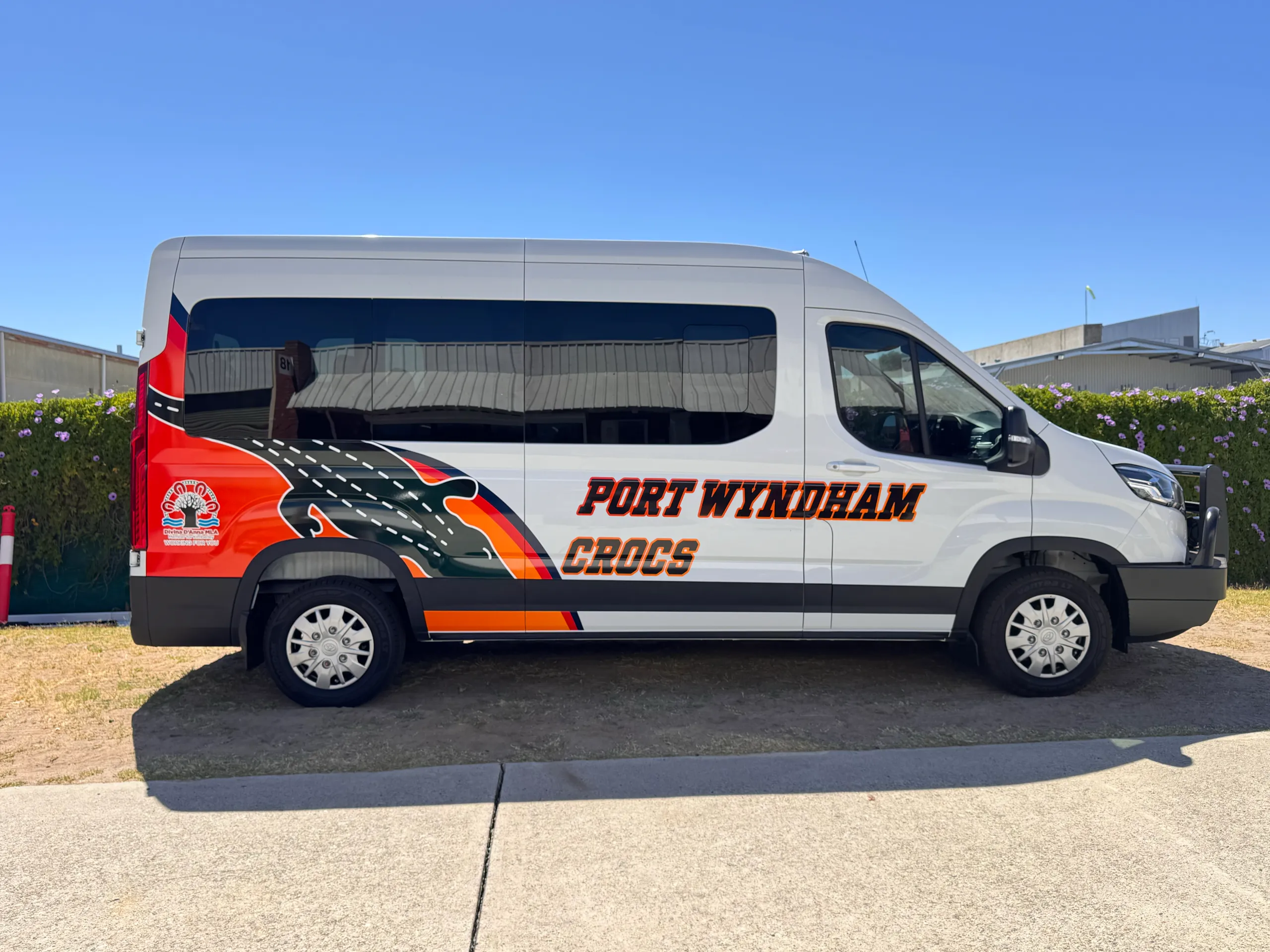 Port Wyndham Crocs LDV van with orange and black crocodile graphics along its white side