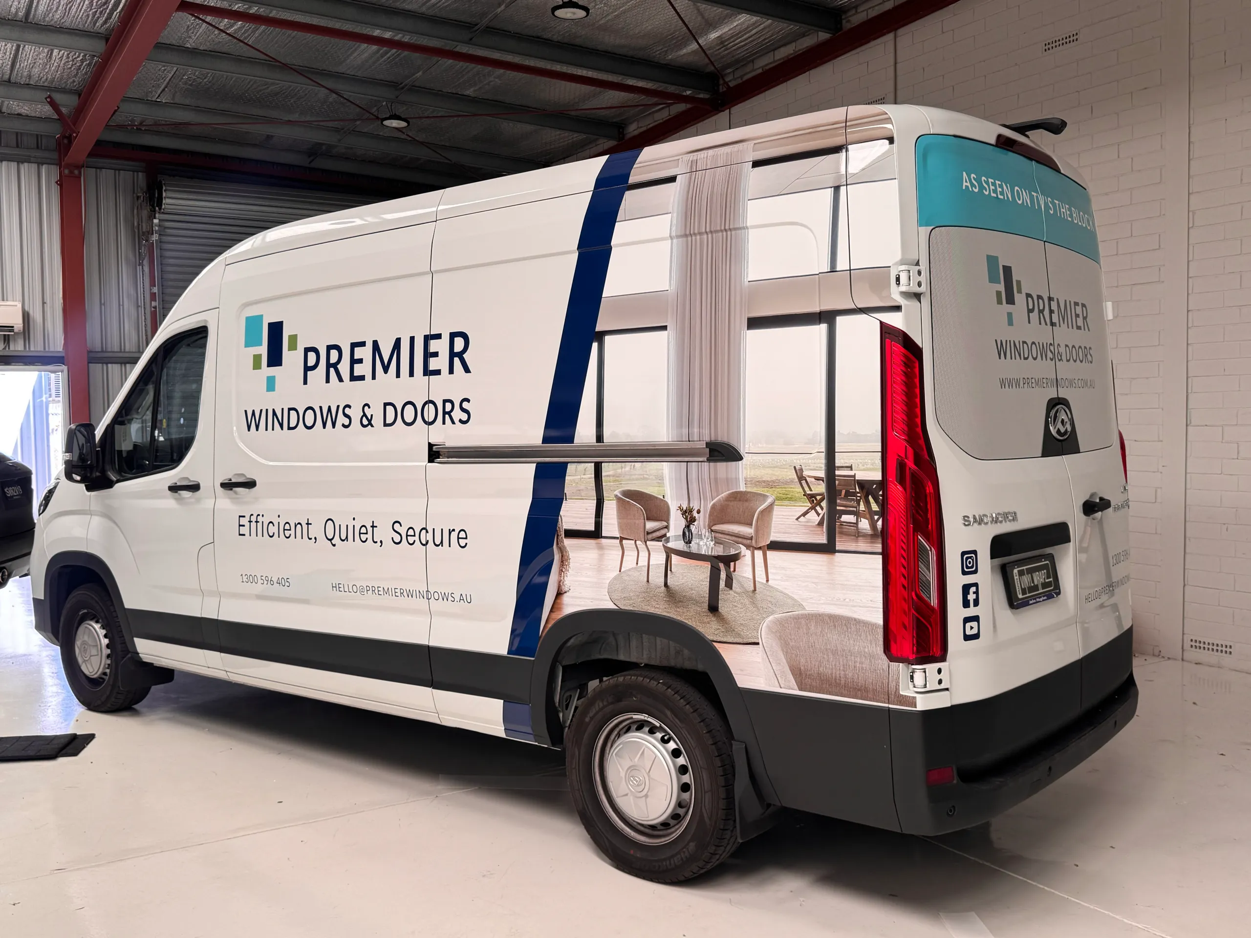 Rear-quarter view of the Premier Windows and Doors LDV van in the workshop
