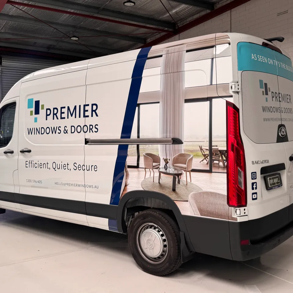 Rear-quarter view of the Premier Windows and Doors LDV van in the workshop