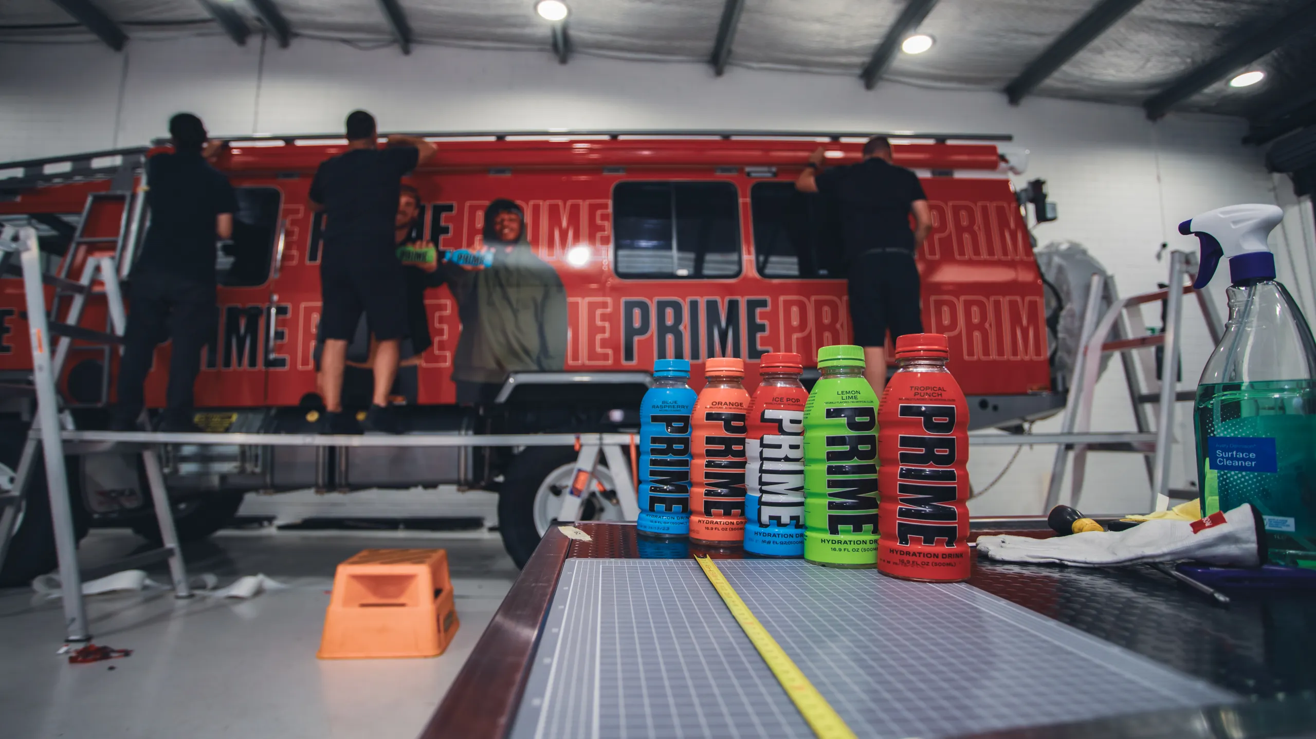 Installers finishing the upper edge of the Oka graphics