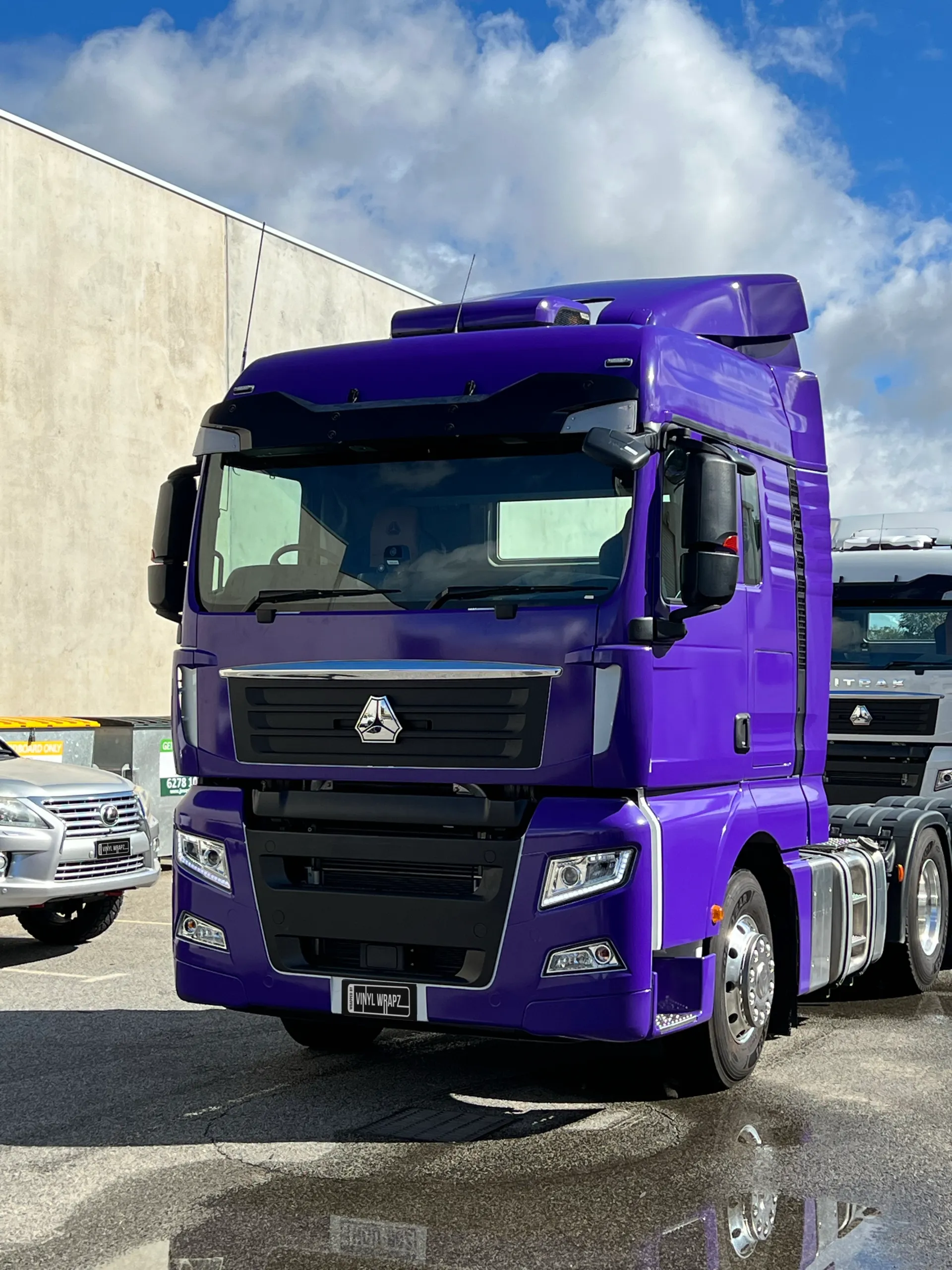 Portrait front view of the purple truck cab
