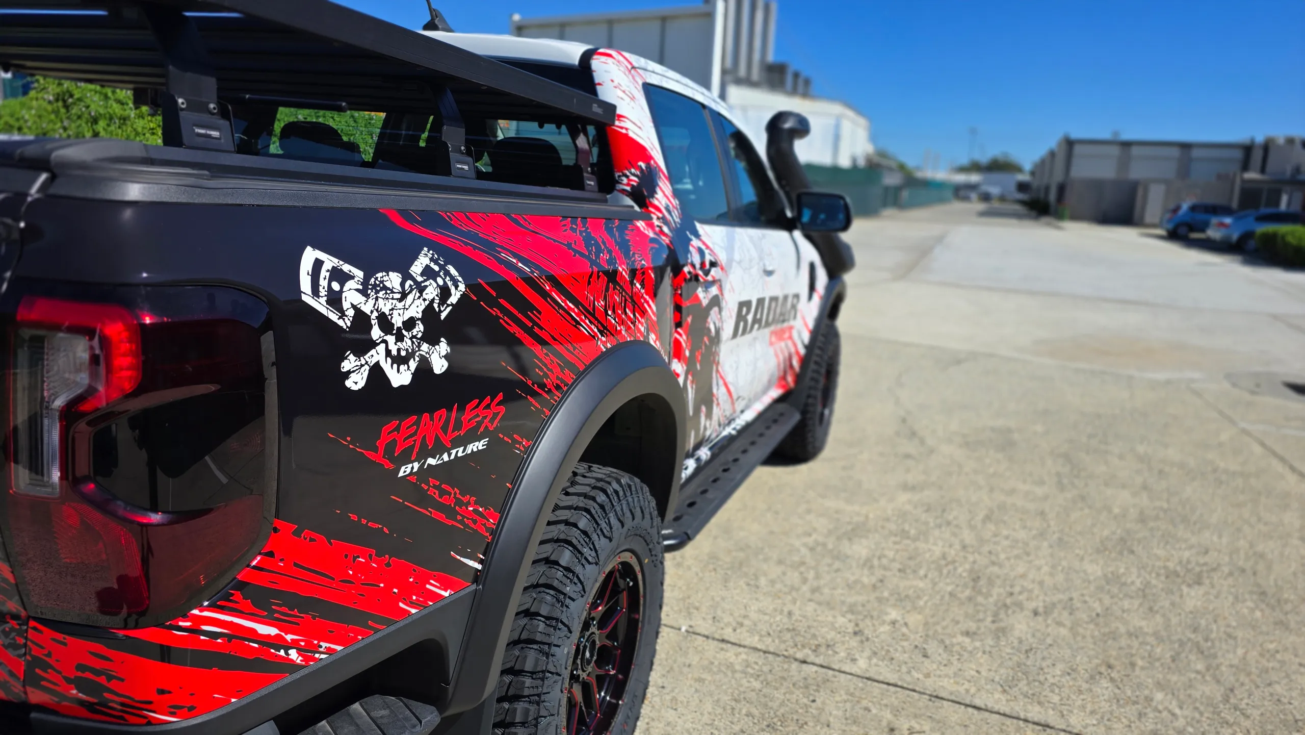 Red and black skull graphics with Fearless by Nature lettering on the Ranger rear quarter