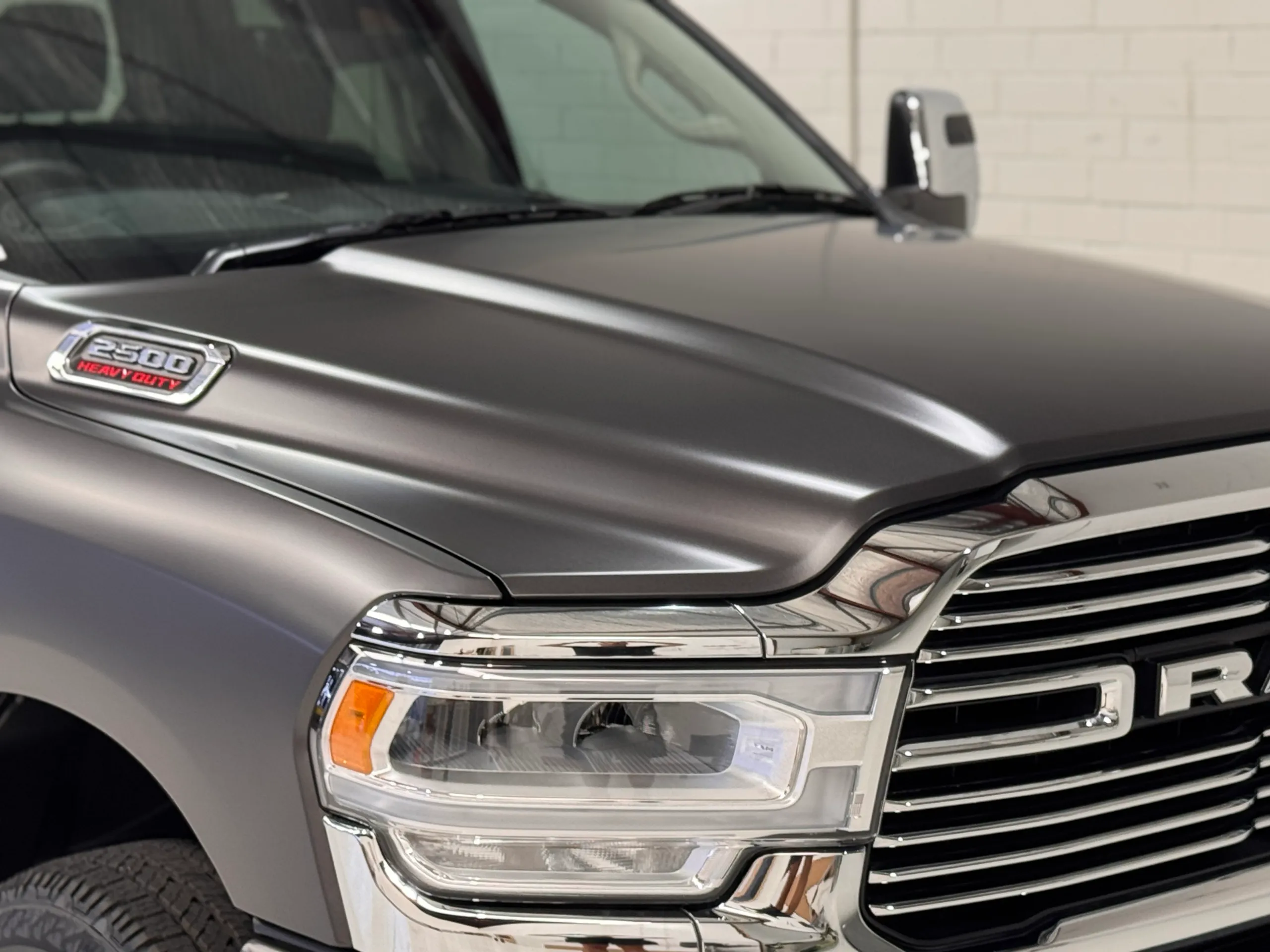 Matte grey Ram 2500 bonnet and headlight with the 2500 badge visible
