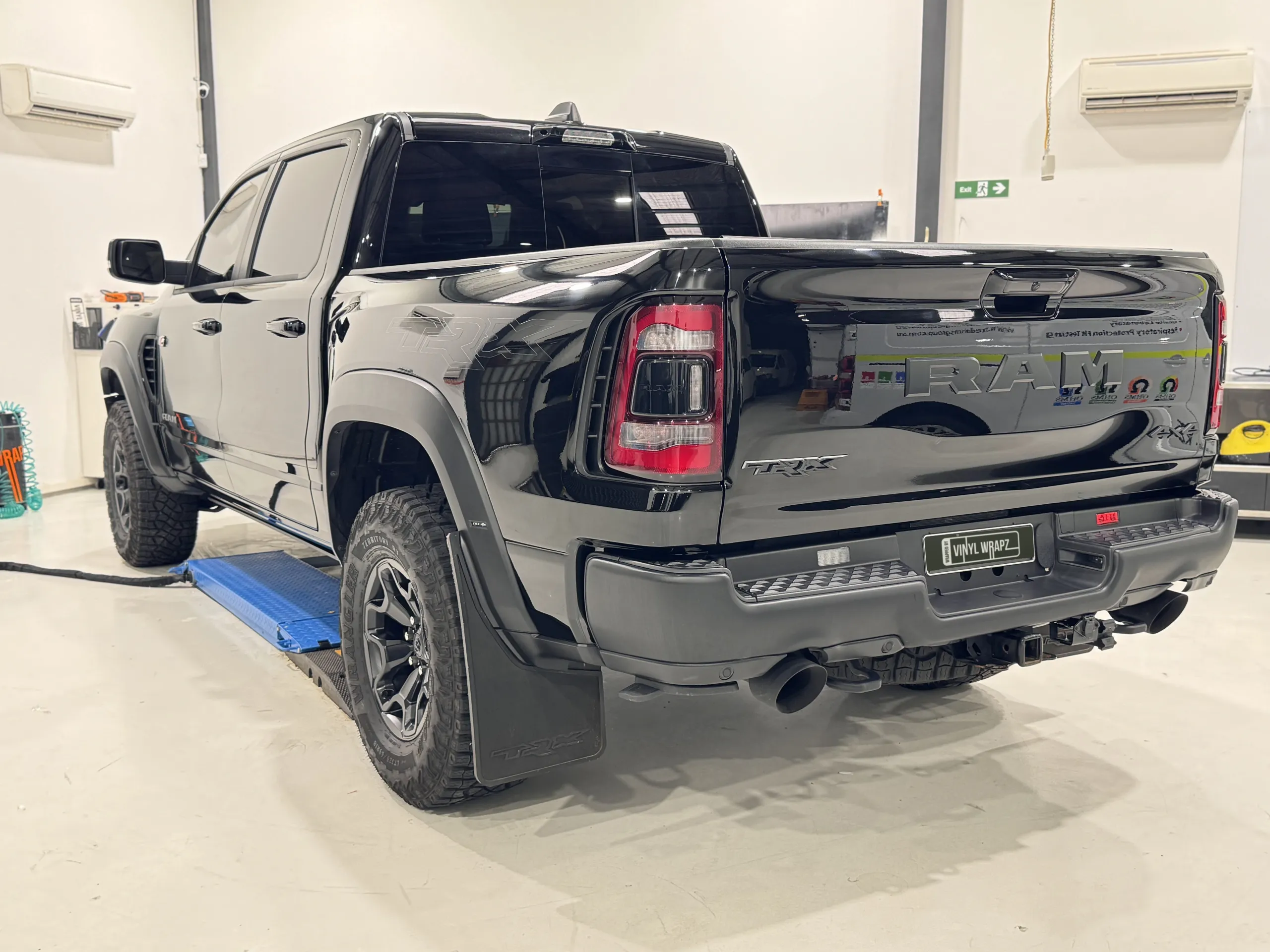 Gloss black Ram TRX viewed from the rear in the workshop