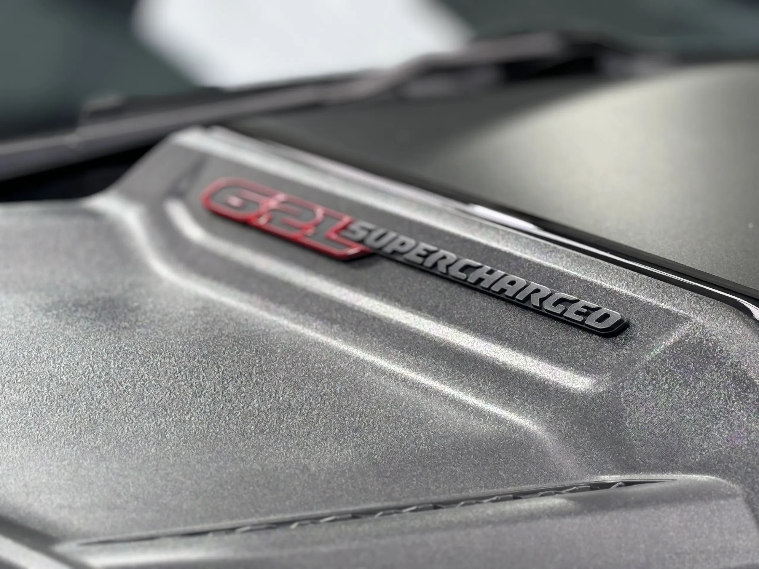 Close-up of the 6.2L Supercharged badge on the Ram TRX bonnet