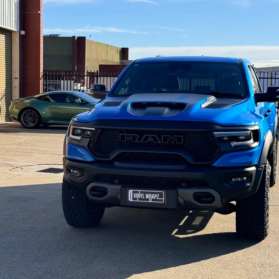 Blue Ram TRX viewed from the front outside the workshop