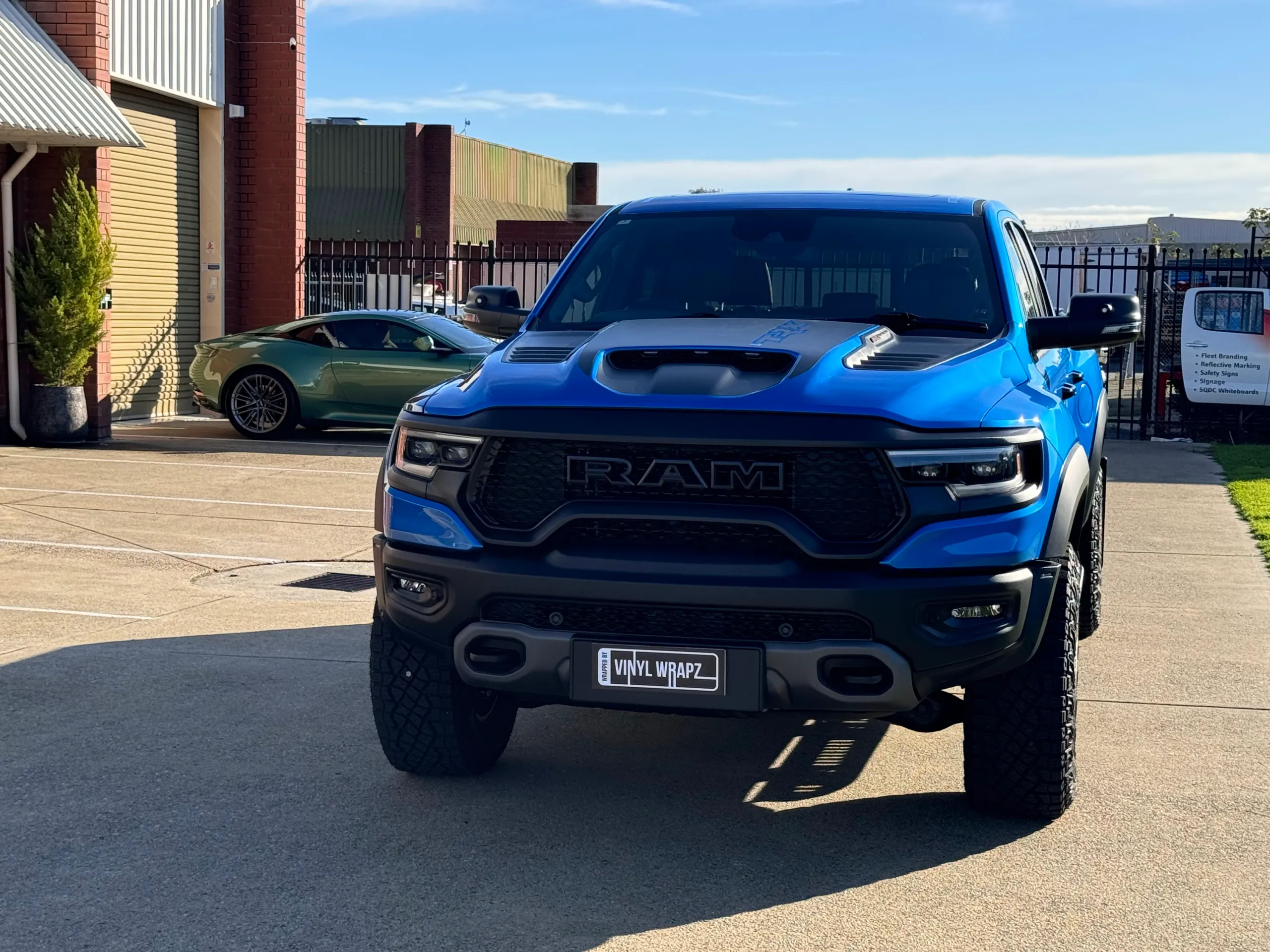 Blue Ram TRX viewed from the front outside the workshop